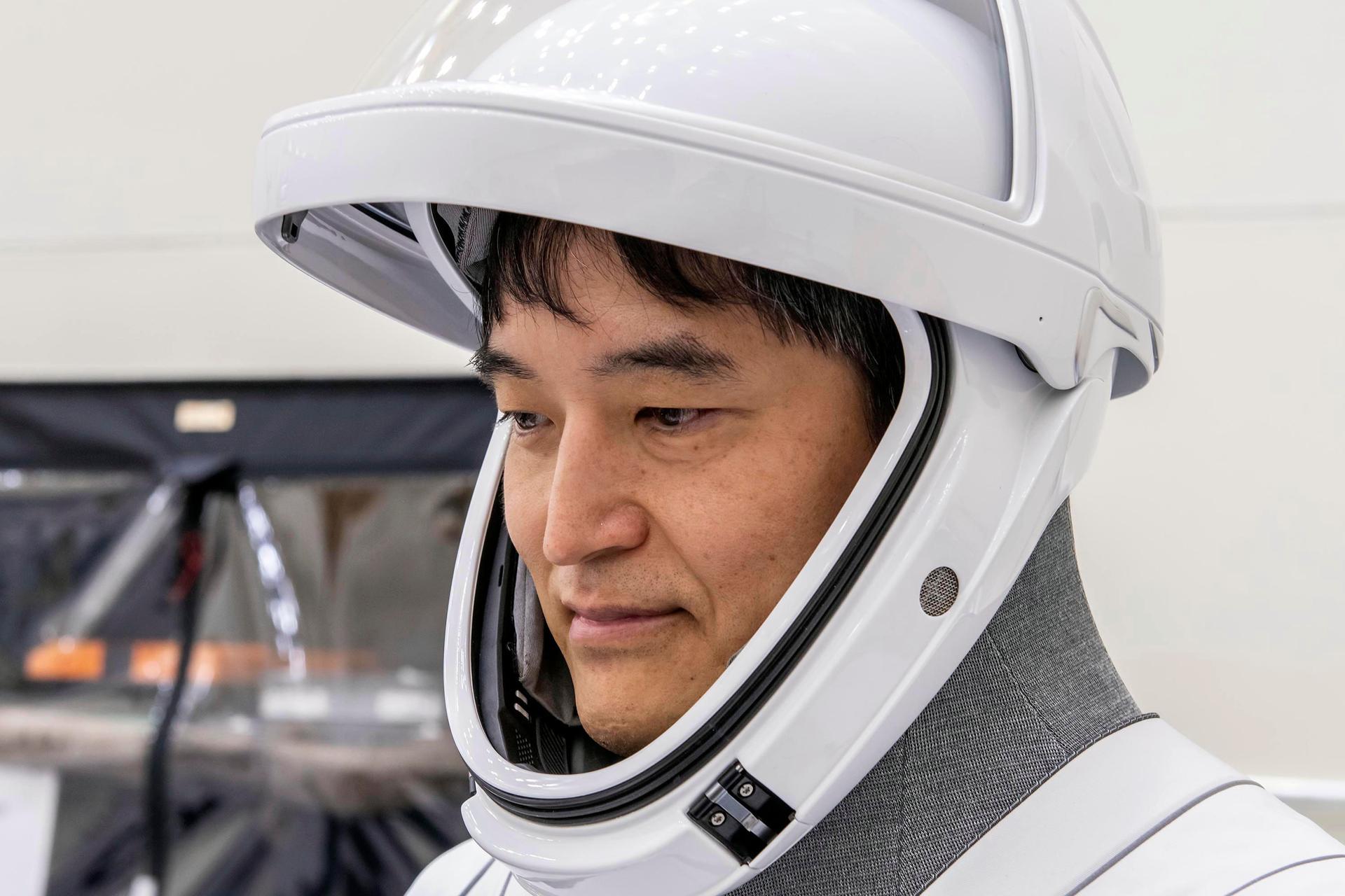 SpaceX Crew-10 Mission Specialist Takuya Onishi of JAXA (Japan Aerospace Exploration Agency) in his flight suit at NASA's Kennedy Space Center in Florida.