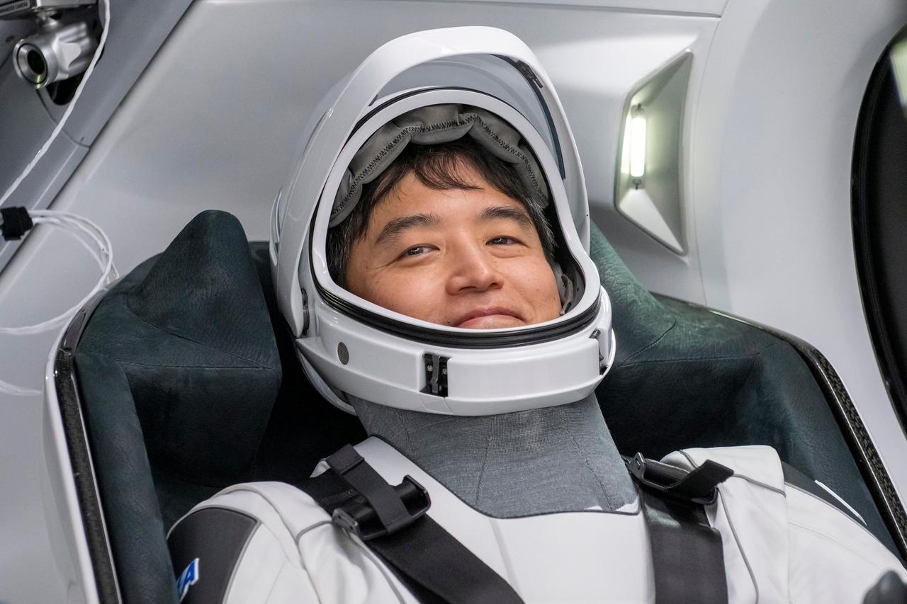 jsc2025e012274 - (February 17, 2025) --- SpaceX Crew-10 Mission Specialist Takuya Onishi of JAXA (Japan Aerospace Exploration Agency) smiles in his flight suit at NASA's Kennedy Space Center in Florida.