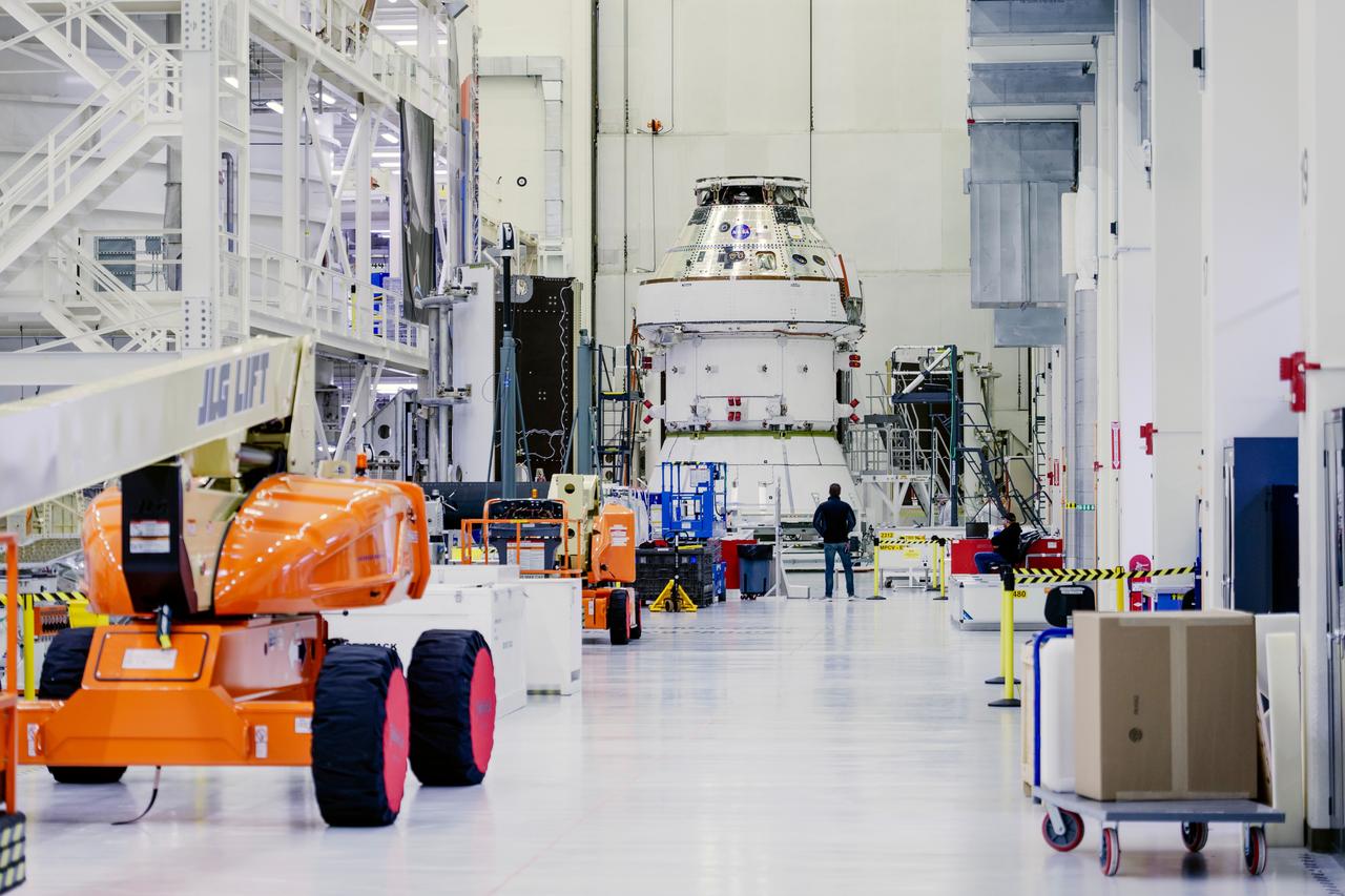 Date: 2/27/2025 Photographer: NASA/Rad Sinyak Caption: Technicians begin working on the installation of the four solar array wings for NASA’s Artemis II Orion spacecraft inside the Operations and Checkout Building at NASA’s Kennedy Space Center on Feb. 27, 2025. Artemis II is Orion’s first crewed flight test around the Moon under the agency’s Artemis campaign.  
