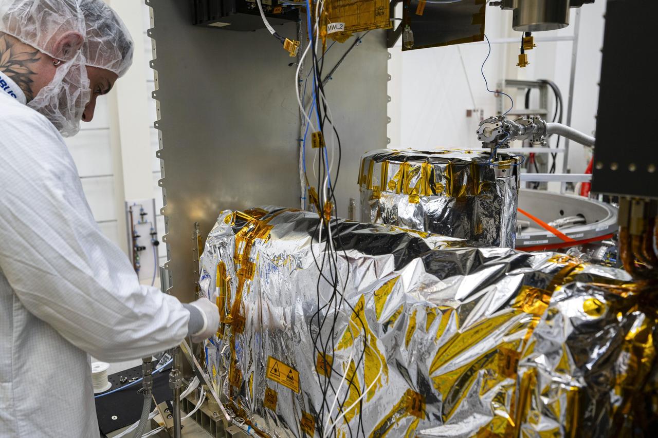jsc2025e015677 (3/6/2025) --- The closure of the instrument panel of the Atomic Clock Ensemble in Space (ACES) has taken place at Airbus Friedrichshafen, Germany. ACES is an ESA instrument that tests fundamental physics, such as Einstein’s theory of general relativity, from the International Space Station. According to this theory, gravity affects the passing of time—time flies faster at the top of Mount Everest than at sea level. This effect has been proven in experiments on Earth, and ACES will make more precise measurements of this phenomenon and other fundamental physics such as the standard model of particle physics, as it flies 400 km high on the space station. ACES contains two clocks: PHARAO, a caesium atomic clock developed by the French Space Agency CNES, and the Space Hydrogen Maser developed by Spectratime, which uses hydrogen atoms as a frequency reference. The payload will be externally mounted to ESA’s Columbus laboratory on the space station. Image courtesy of S. Corvaja (ESA).