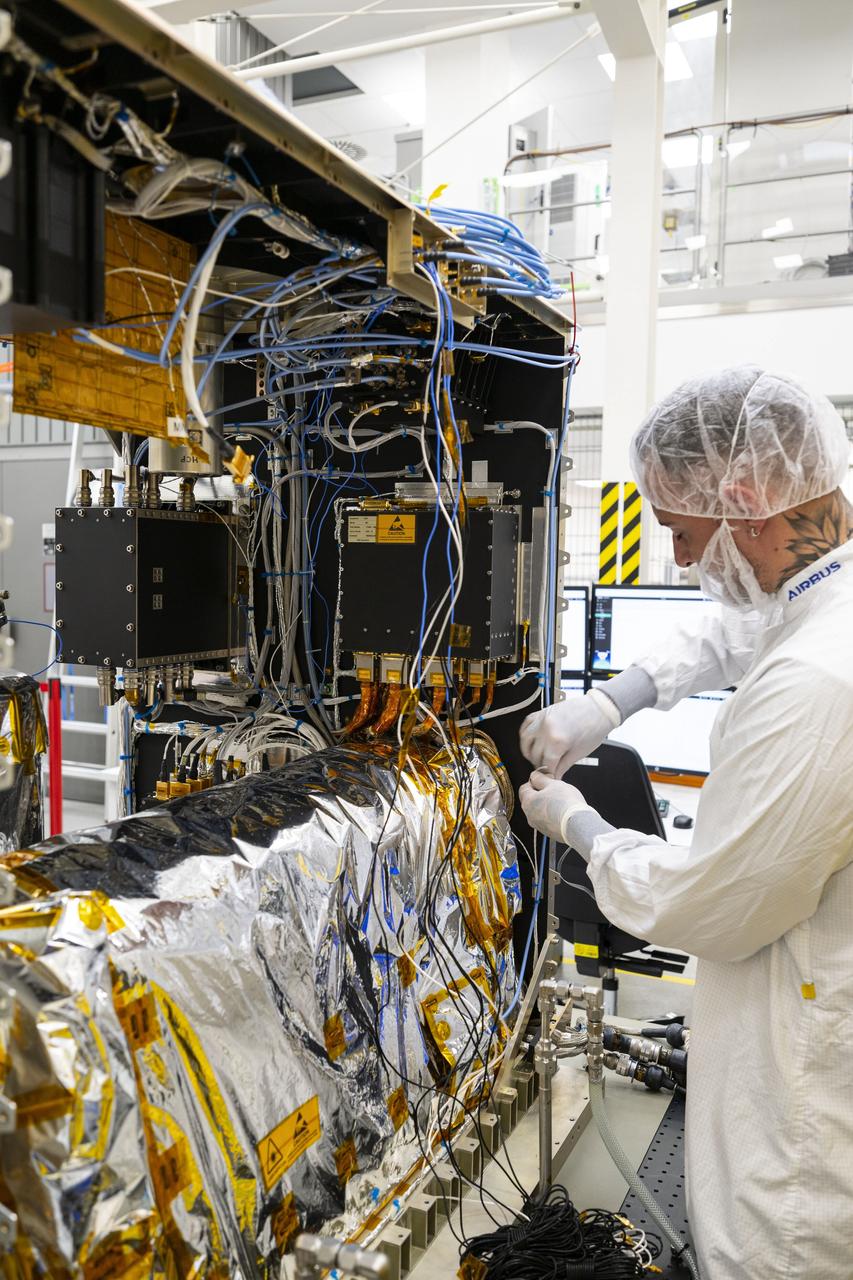 jsc2025e015678 (3/6/2025) --- The closure of the instrument panel of the Atomic Clock Ensemble in Space (ACES) has taken place at Airbus Friedrichshafen, Germany. ACES is an ESA instrument that tests fundamental physics, such as Einstein’s theory of general relativity, from the International Space Station. According to this theory, gravity affects the passing of time—time flies faster at the top of Mount Everest than at sea level. This effect has been proven in experiments on Earth, and ACES will make more precise measurements of this phenomenon and other fundamental physics such as the standard model of particle physics, as it flies 400 km high on the space station. ACES contains two clocks: PHARAO, a caesium atomic clock developed by the French Space Agency CNES, and the Space Hydrogen Maser developed by Spectratime, which uses hydrogen atoms as a frequency reference. The payload will be externally mounted to ESA’s Columbus laboratory on the space station. Image courtesy of S. Corvaja (ESA).