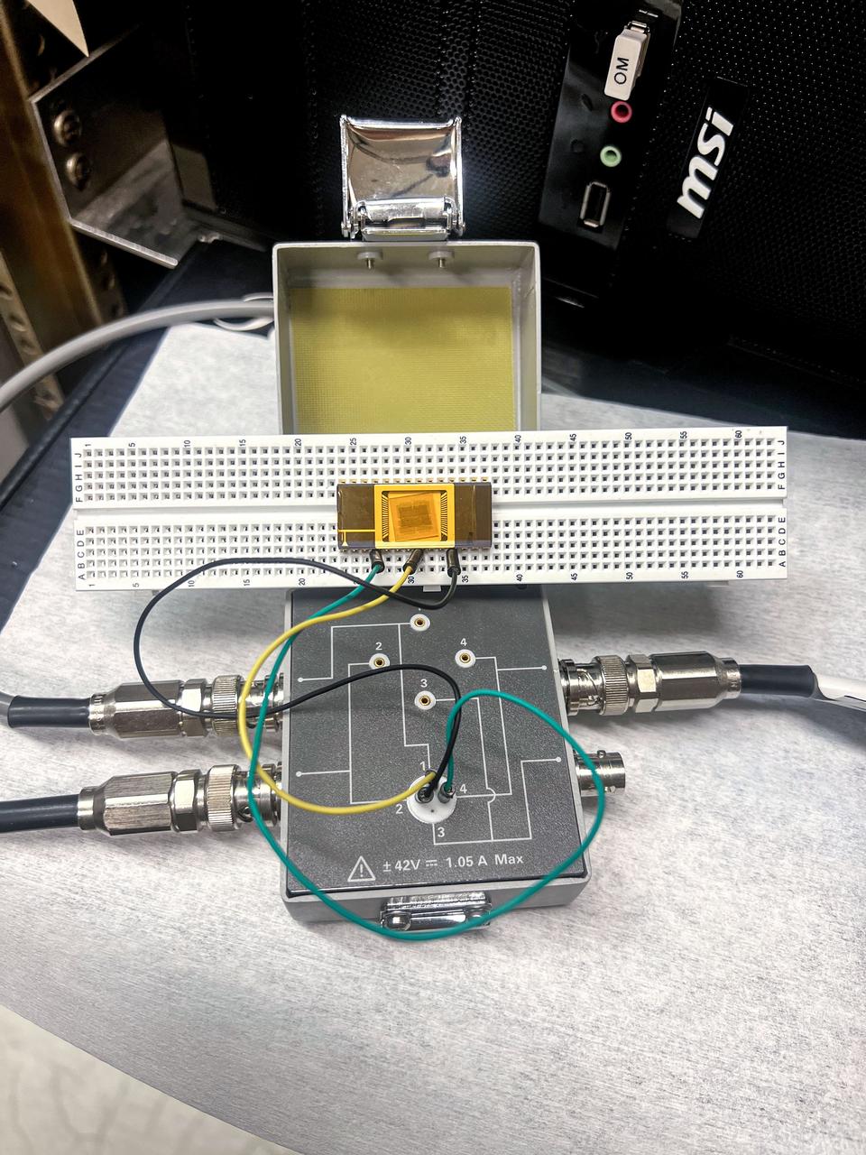 jsc2025e015683 (3/6/2025) --- The chip carrier setup shows the GaN devices are wire bonded to perform electrical measurement as part of the High Performance Radiation Hardened GaN High Electron Mobility Transistors for Space Applications (Radiation Harden GaN) investigation which studies how radiation affects a type of transistor used in the semiconductor industry. Researchers measure the performance of the devices before, during, and after flight to determine whether performance degrades. This could help determine how well the transistors can tolerate radiation in space. Image courtesy of Department of Electrical and Computer Engineering, University of Delaware.