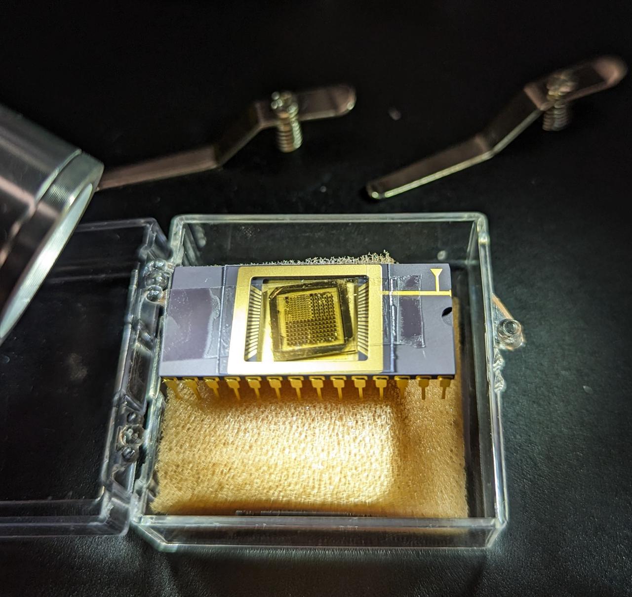 jsc2025e015685c(3/6/2025) --- The GaN devices wire bonded to a chip carrier as part of the High Performance Radiation Hardened GaN High Electron Mobility Transistors for Space Applications (Radiation Harden GaN) investigation which studies how radiation affects a type of transistor used in the semiconductor industry. Researchers measure the performance of the devices before, during, and after flight to determine whether performance degrades. This could help determine how well the transistors can tolerate radiation in space.  Image courtesy of Department of Electrical and Computer Engineering, University of Delaware.