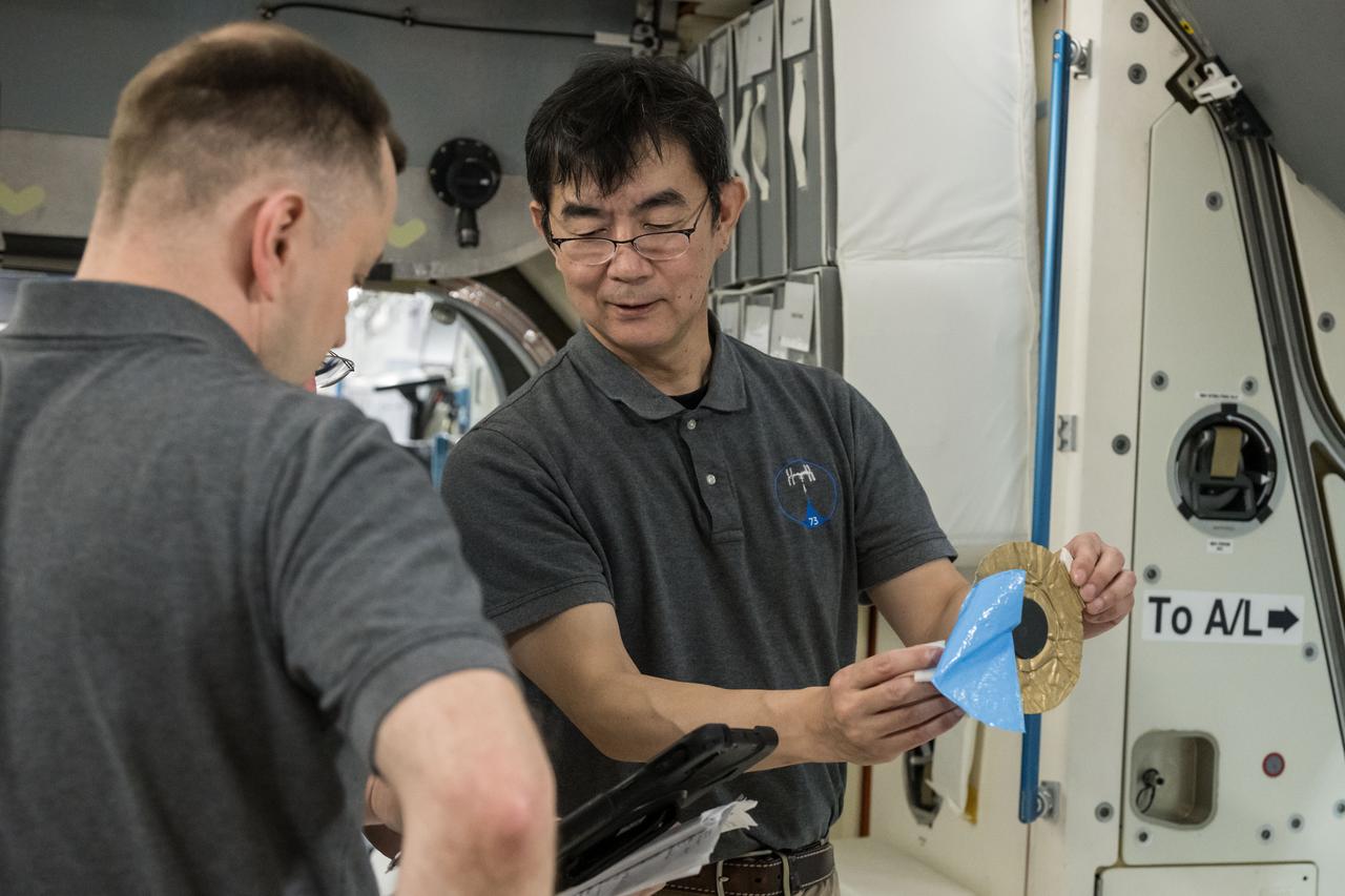 jsc2025e032524 (March 18, 2025) --- Roscosmos cosmonaut Oleg Platonov (left) and JAXA astronaut Kimiya Yui (right) conduct training for the unlikely event of an emergency at the Space Vehicle Mockup Facility at NASA’s Johnson Space Center in Houston, Texas. Credit: NASA/David DeHoyos