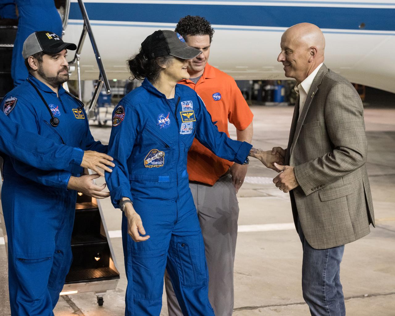 jsc2025e032539 (March 18, 2025) --- NASA astronaut Suni Williams returns to Johnson Space Center's Ellington Field in Houston after completing a long-duration science mission aboard the International Space Station and is greeted by Steve Koerner, Johnson's acting center director. After undocking from the orbiting laboratory, NASA’s SpaceX Crew-9 splashed down at 5:57 p.m. EDT on Tuesday, March 18, in the Gulf of America near Tallahassee, Florida.