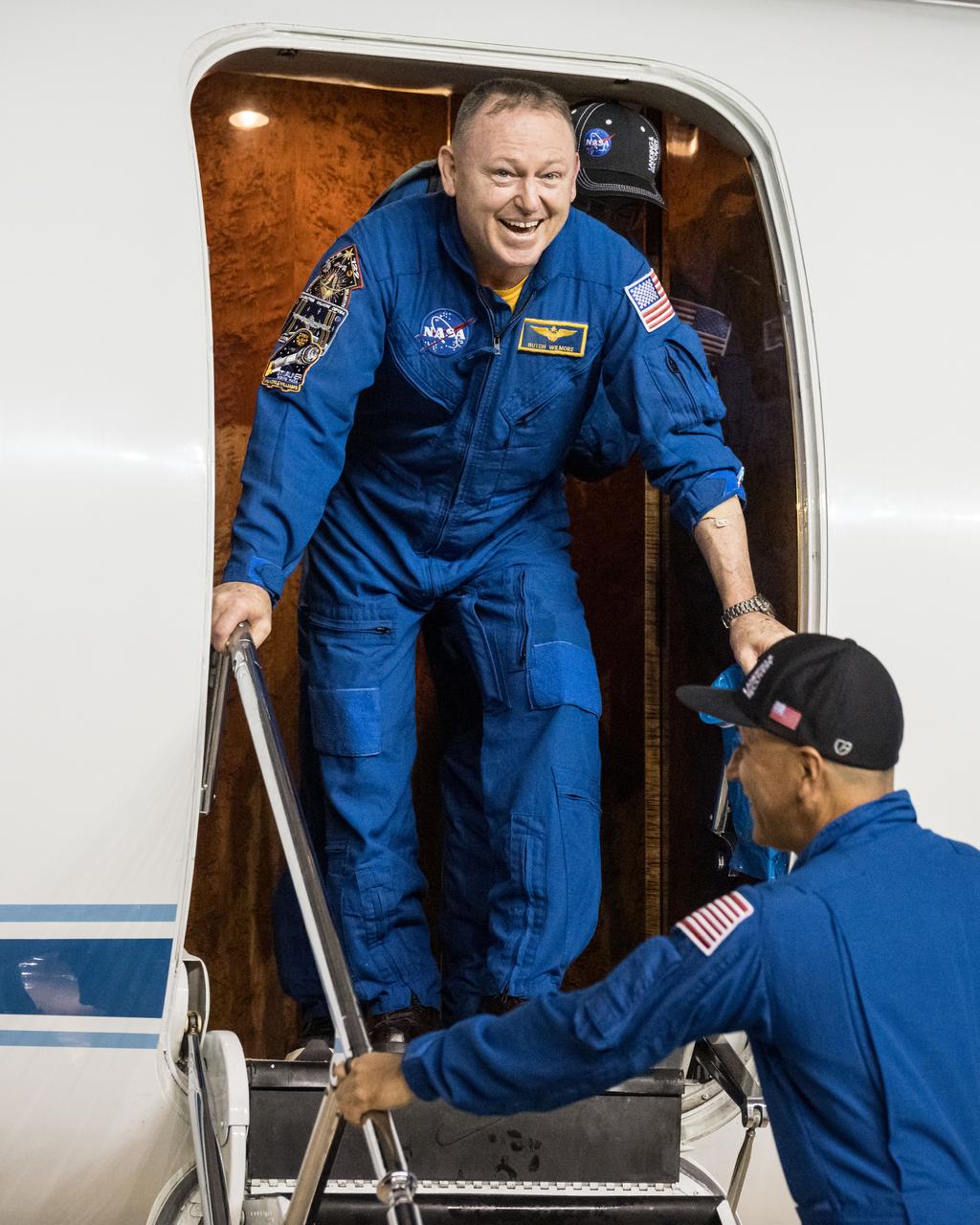 jsc2025e032540 (March 18, 2025) --- NASA astronaut Butch Wilmore receives a warm welcome at Johnson Space Center's Ellington Field in Houston after completing a long-duration science mission aboard the International Space Station. After undocking from the orbiting laboratory, NASA’s SpaceX Crew-9 splashed down at 5:57 p.m. EDT on Tuesday, March 18, in the Gulf of America near Tallahassee, Florida.