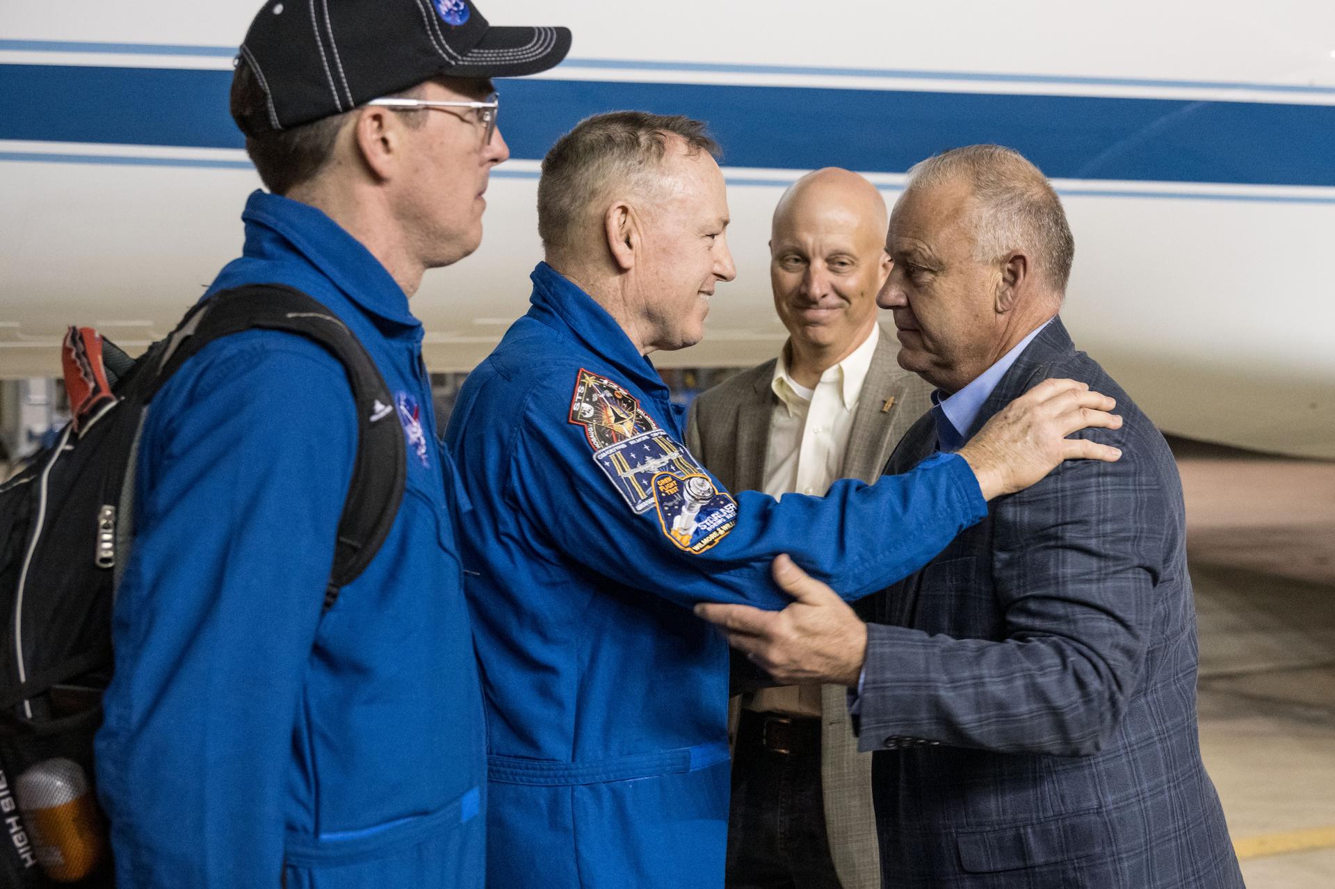 After completing a long-duration science mission aboard the International Space Station, NASA astronaut Butch Wilmore returns to Johnson Space Center's Ellington Field in Houston and is greeted by Steve Koerner, acting center director, and Norm Knight, acting deputy center director. NASA’s SpaceX Crew-9 splashed down at 5:57 p.m. EDT on Tuesday, March 18, in the Gulf of America near Tallahassee, Florida.