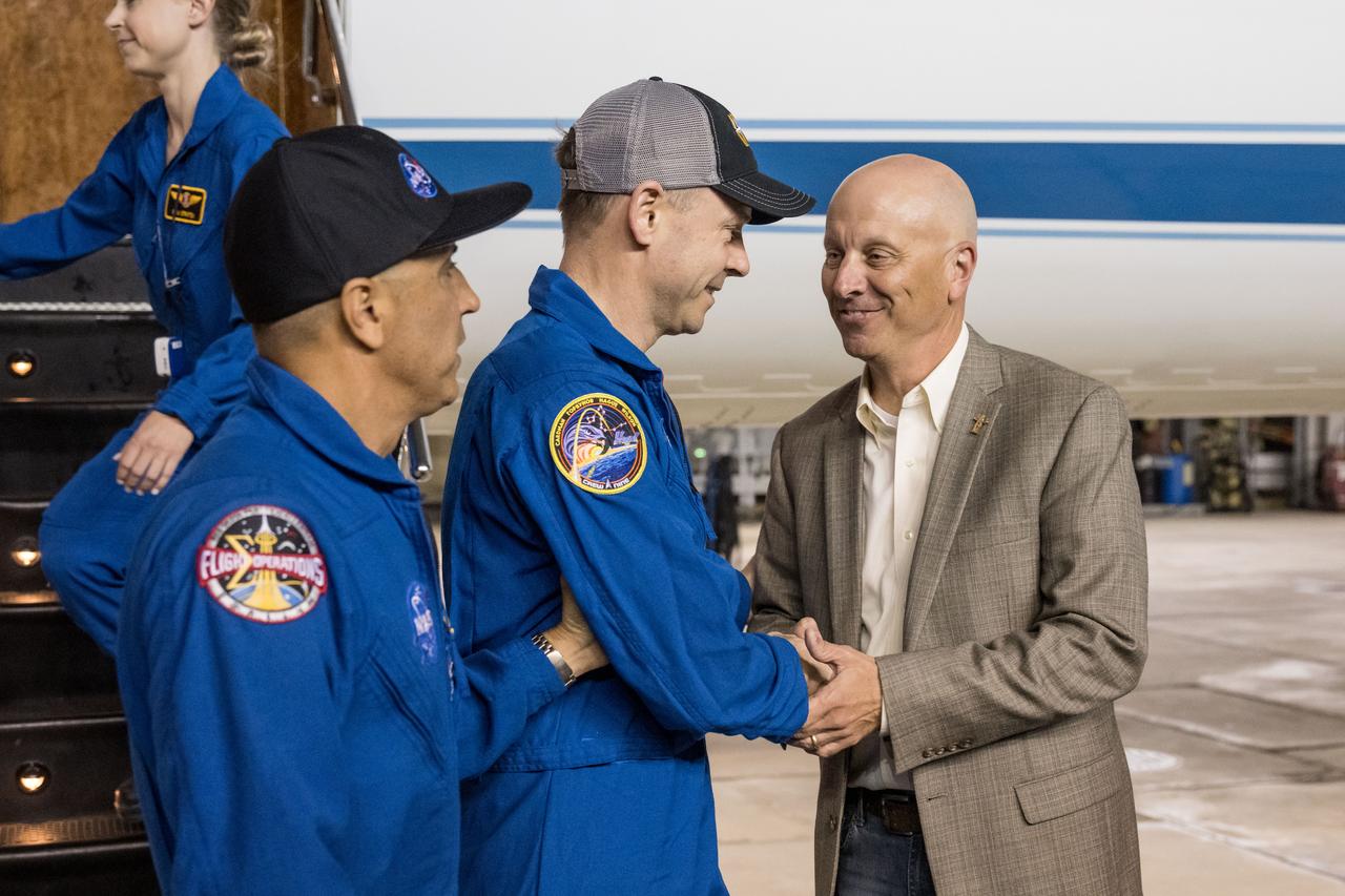 jsc2025e032542 (March 18, 2025) --- After completing a long-duration science mission aboard the International Space Station, NASA astronaut Nick Hague returns to Johnson Space Center's Ellington Field in Houston with Chief of the Astronaut Office, Joe Acaba and is greeted by Steve Koerner, acting center director. NASA’s SpaceX Crew-9 splashed down at 5:57 p.m. EDT on Tuesday, March 18, in the Gulf of America near Tallahassee, Florida.