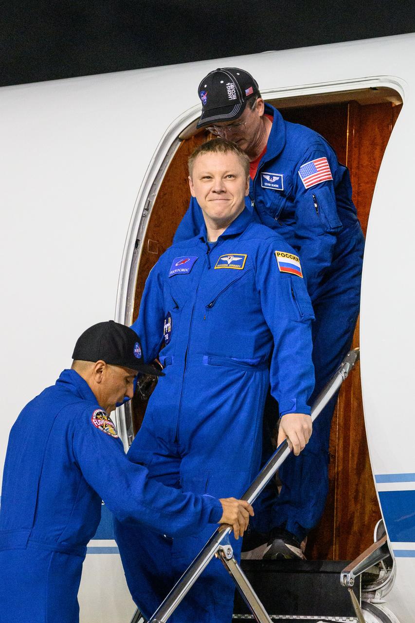 jsc2025e032668 (March 18, 2025) --- Roscosmos cosmonaut Aleksandr Gorbunov smiles as he returns to Johnson Space Center's Ellington Field in Houston after completing a long-duration science mission aboard the International Space Station. After undocking from the orbiting laboratory, NASA’s SpaceX Crew-9 splashed down at 5:57 p.m. EDT on Tuesday, March 18, in the Gulf of America near Tallahassee, Florida.