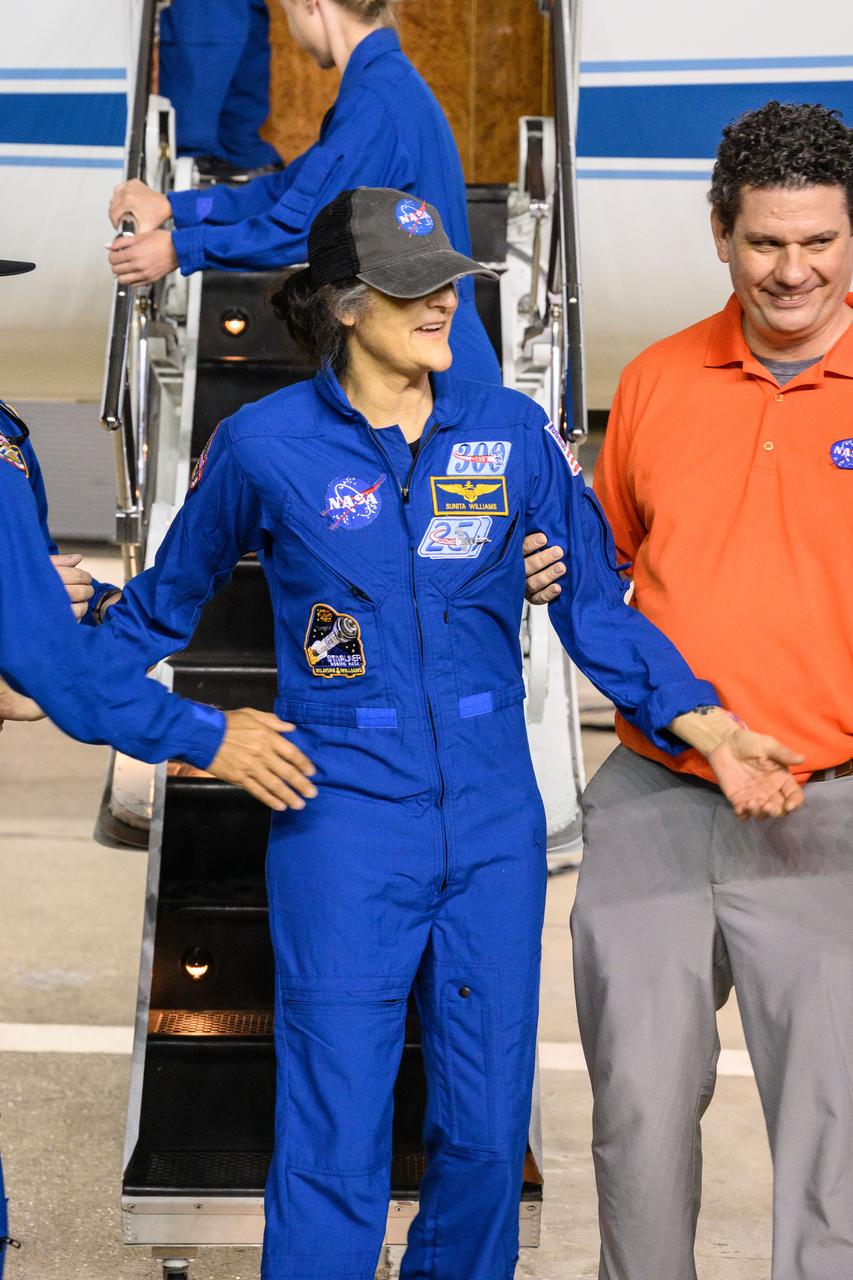 jsc2025e032669 (March 18, 2025) --- NASA astronaut Suni Williams returns to Johnson Space Center's Ellington Field in Houston after completing a long-duration science mission aboard the International Space Station. After undocking from the orbiting laboratory, NASA’s SpaceX Crew-9 splashed down at 5:57 p.m. EDT on Tuesday, March 18, in the Gulf of America near Tallahassee, Florida.