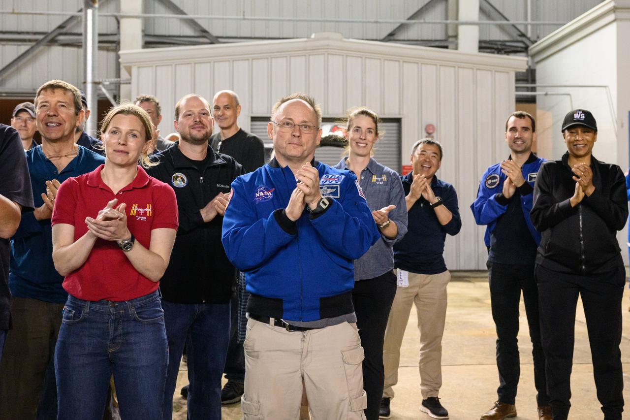 jsc2025e032670 (March 18, 2025) --- Members of the NASA astronaut corps cheer on Crew-9 as they returned to Johnson Space Center's Ellington Field in Houston on March 18. After undocking from the orbiting laboratory, NASA’s SpaceX Crew-9 splashed down at 5:57 p.m. EDT on Tuesday, March 18, in the Gulf of America near Tallahassee, Florida.