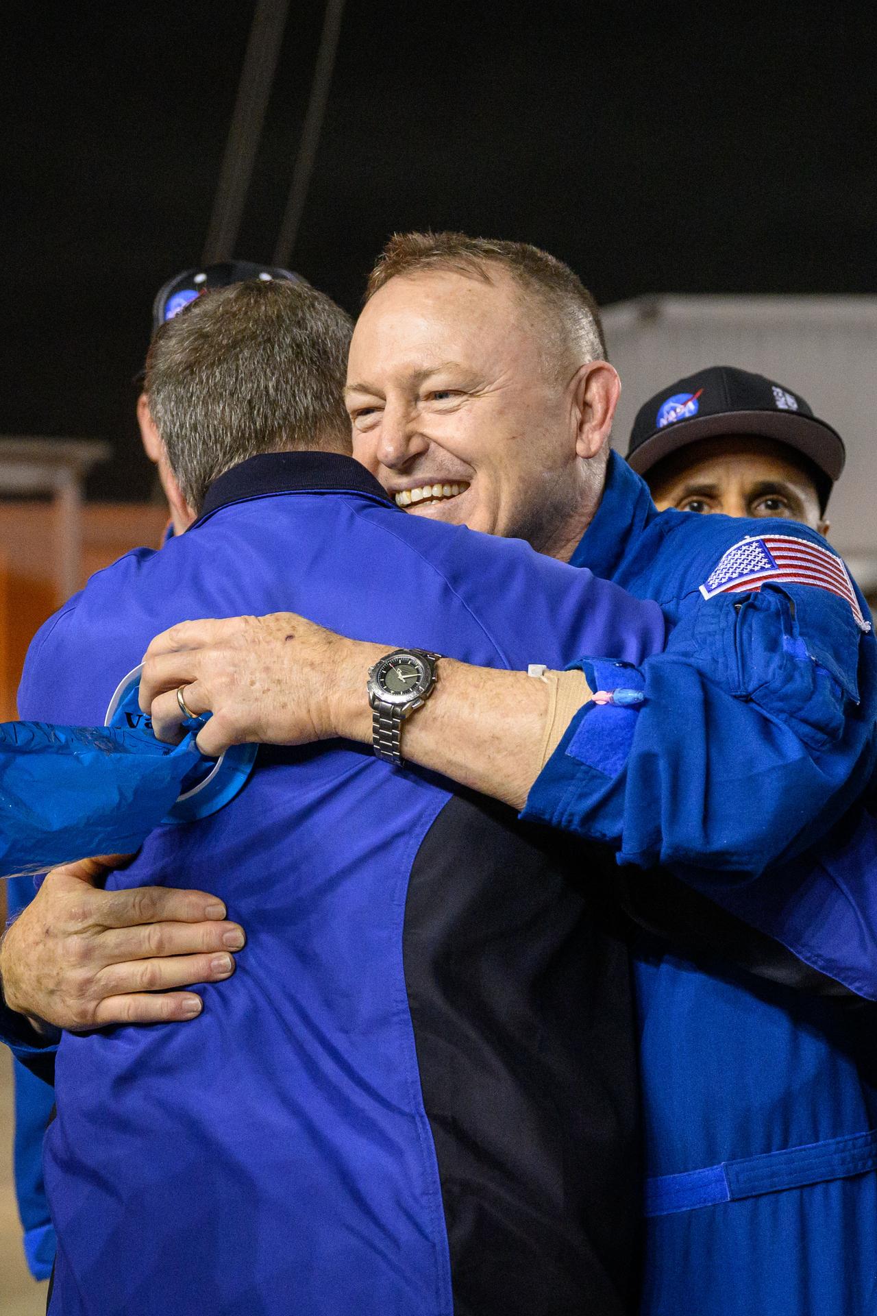NASA astronaut Butch Wilmore receives a warm welcome at Johnson Space Center's Ellington Field in Houston after completing a long-duration science mission aboard the International Space Station. After undocking from the orbiting laboratory, NASA’s SpaceX Crew-9 splashed down at 5:57 p.m. EDT on Tuesday, March 18, in the Gulf of America near Tallahassee, Florida. Credit: NASA/Helen Arase Vargas