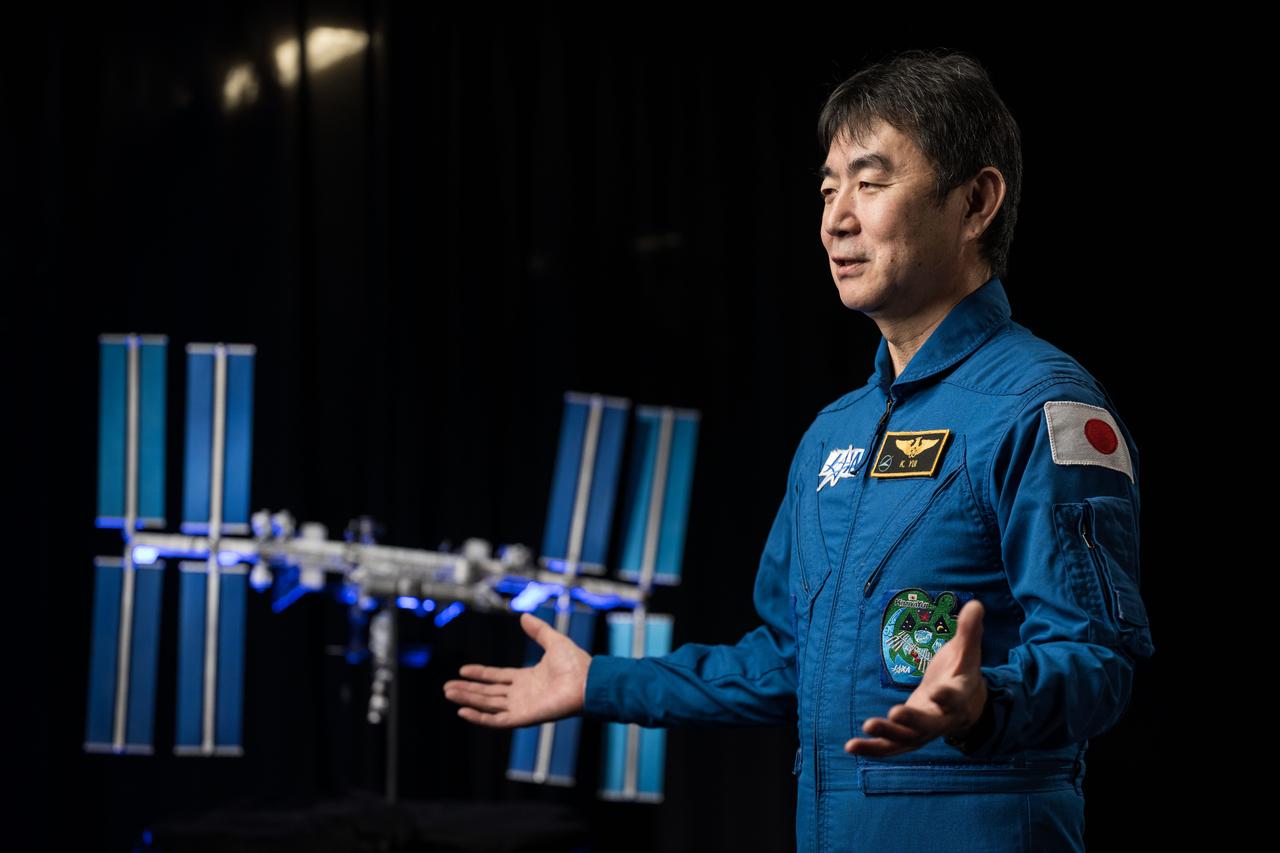 jsc2025e032710 (March 20, 2025) --- JAXA astronaut Kimiya Yui is photographed during an interview in a studio at NASA’s Johnson Space Center in Houston, Texas, before his upcoming mission to the International Space Station. Credit: NASA/Josh Valcarcel