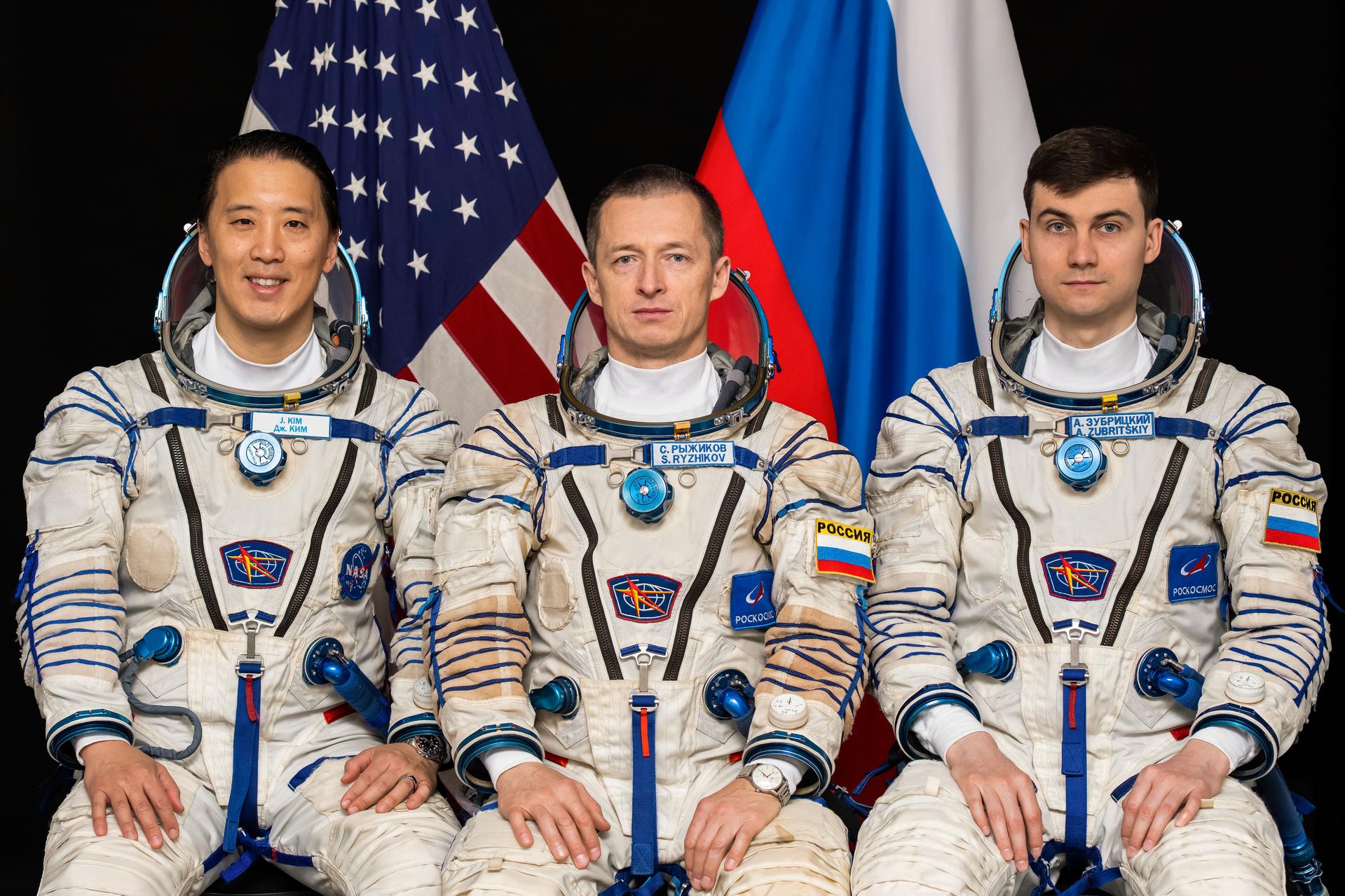 Soyuz MS-27 crew members (frm left) NASA astronaut Jonny Kim and Roscosmos cosmonauts Sergey Ryzhikov and Alexey Zubritsky pose for a portrait at the Gagarin Cosmonaut Training Center in Russia.