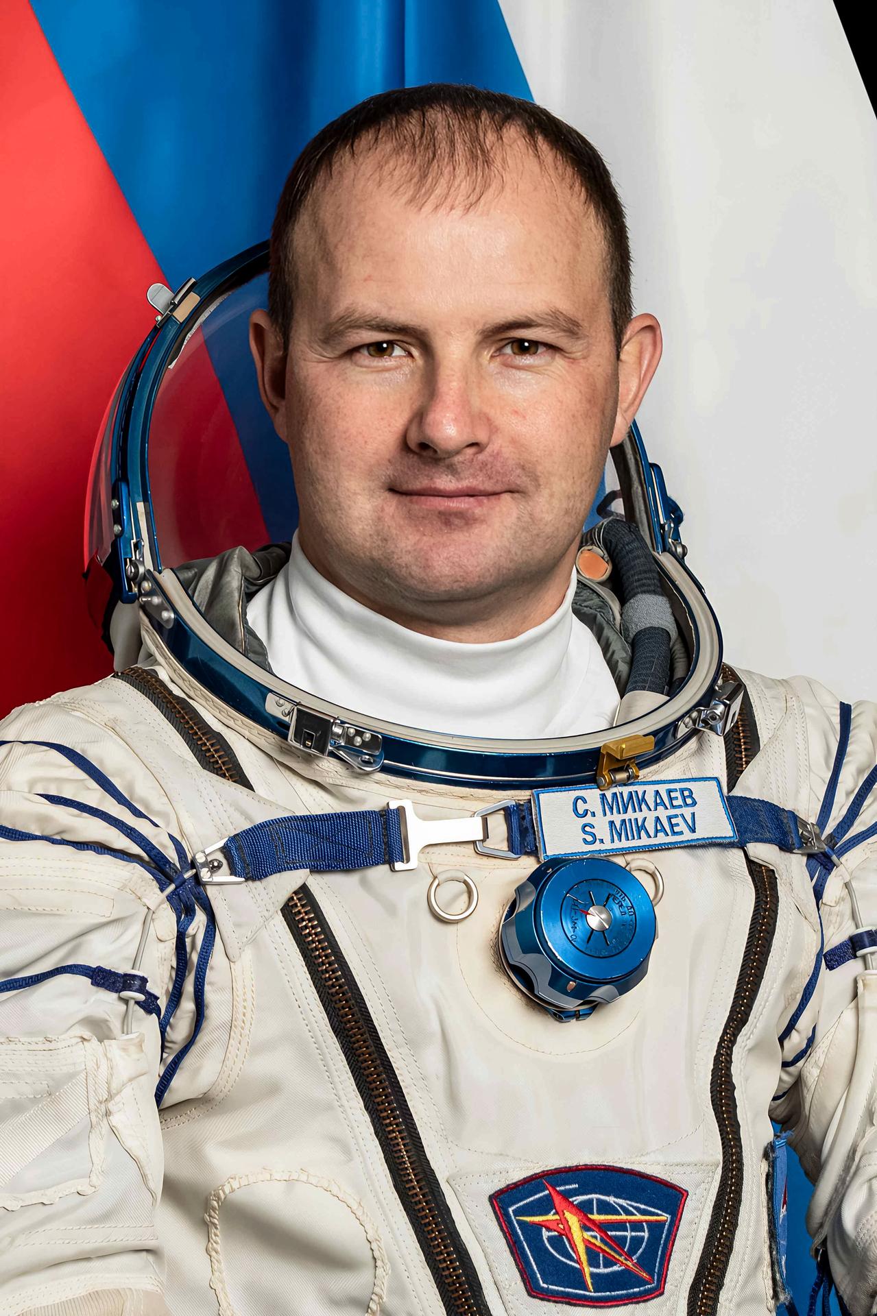 Roscosmos cosmonaut and Soyuz MS-27 Backup Flight Engineer Sergey Mikaev poses for a portrait in his Sokol launch and entry suit at the Gagarin Cosmonaut Training Center in Star City, Russia.