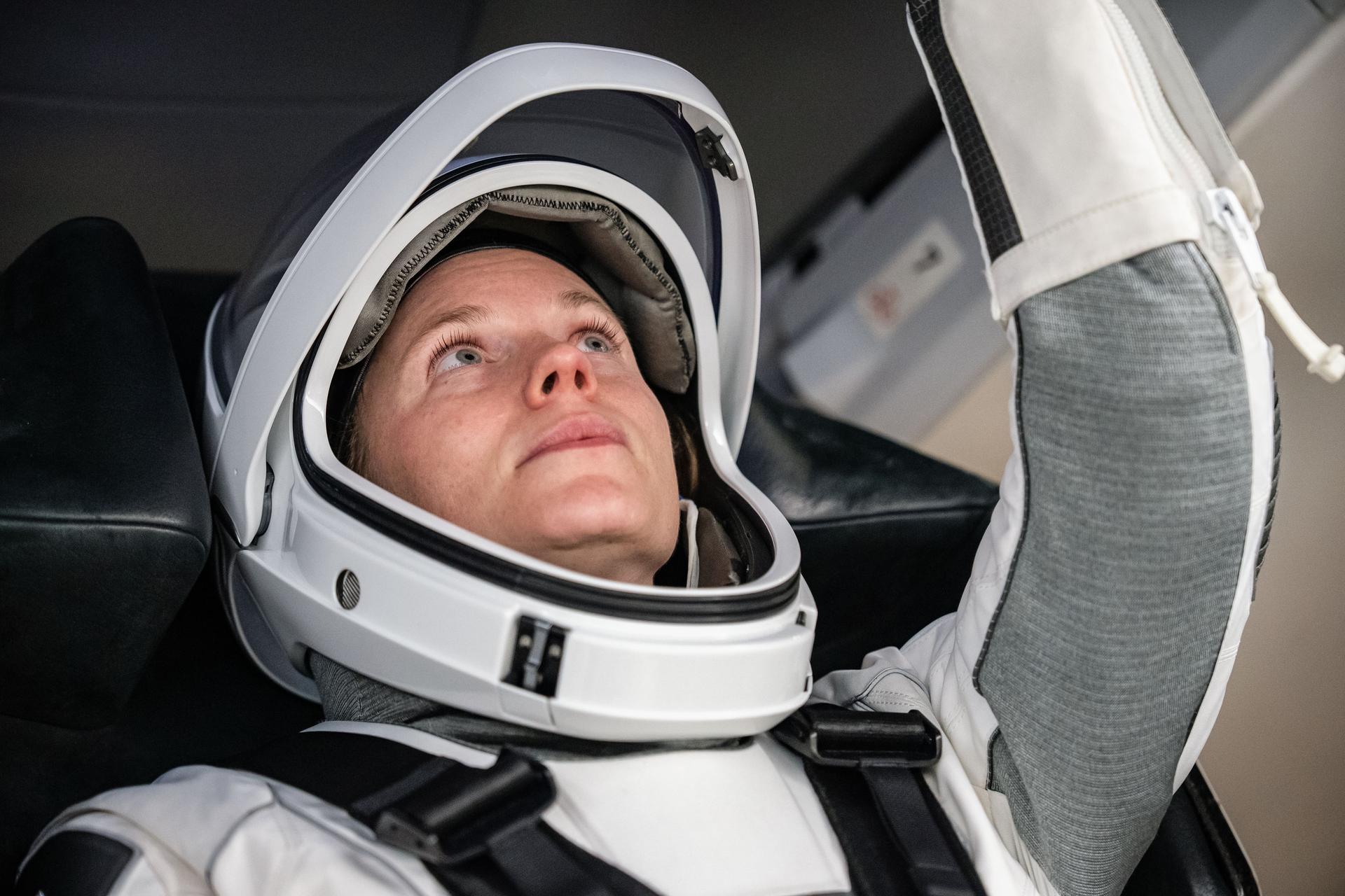 NASA astronaut Zena Cardman, commander of NASA’s SpaceX Crew-11 mission, trains inside a SpaceX Dragon mockup at a SpaceX facility in Hawthorne, California, ahead of her flight to the International Space Station.