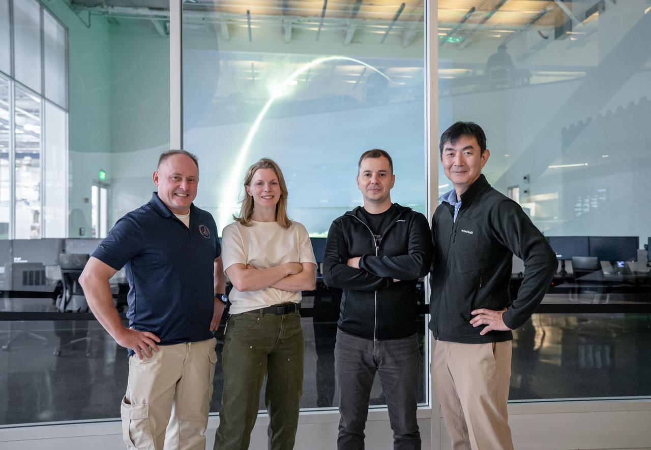 jsc2025e034095 (Sept. 25, 2024) --- From left to right, NASA astronauts Mike Fincke and Zena Cardman, Roscosmos cosmonaut Oleg Platonov, and JAXA (Japan Aerospace Exploration Agency) astronaut Kimiya Yui pose for a photo at a SpaceX facility in Hawthorne, California. Credit: SpaceX