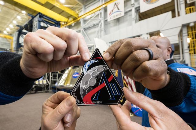 NASA image: Artemis II Crew Holds Mission Patch