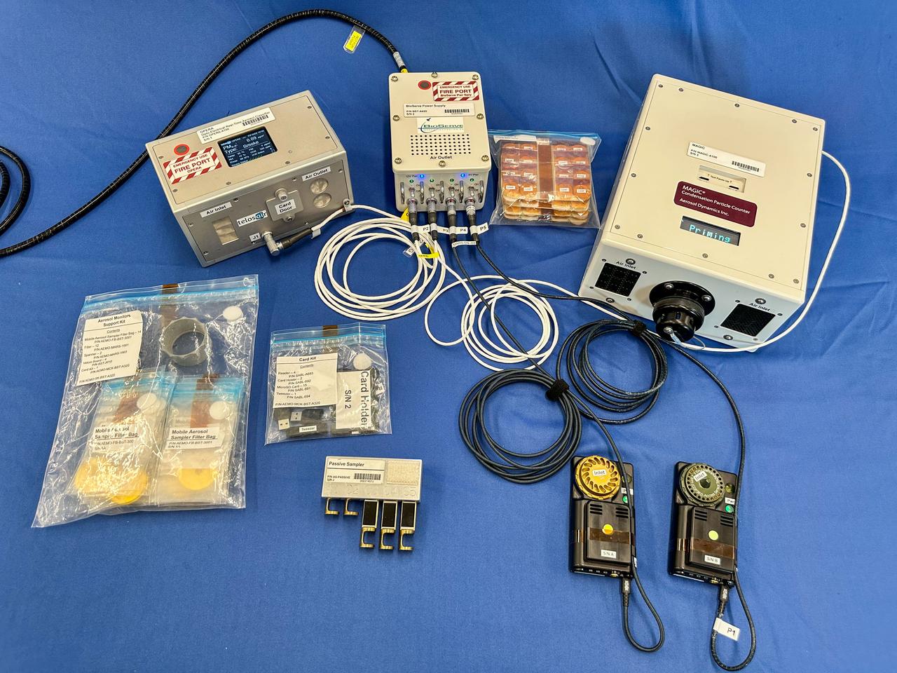 jsc2025e036188 (2/3/2025) --- A preflight image of the Exploration Aerosol Monitors (ExAM) hardware which includes the Moderated Aerosol Growth with Internal water Cycling (MAGIC) particle counter, the OPto-electrical Realtime Aerosol classifier (OPERA), the Mobile Aerosol Reference Samplers (MARS). Aerosol Monitors demonstrates technologies to continuously monitor the concentration of airborne pollutant particles, which must be kept within safe ranges, inside the International Space Station. Image courtesy of BioServe.