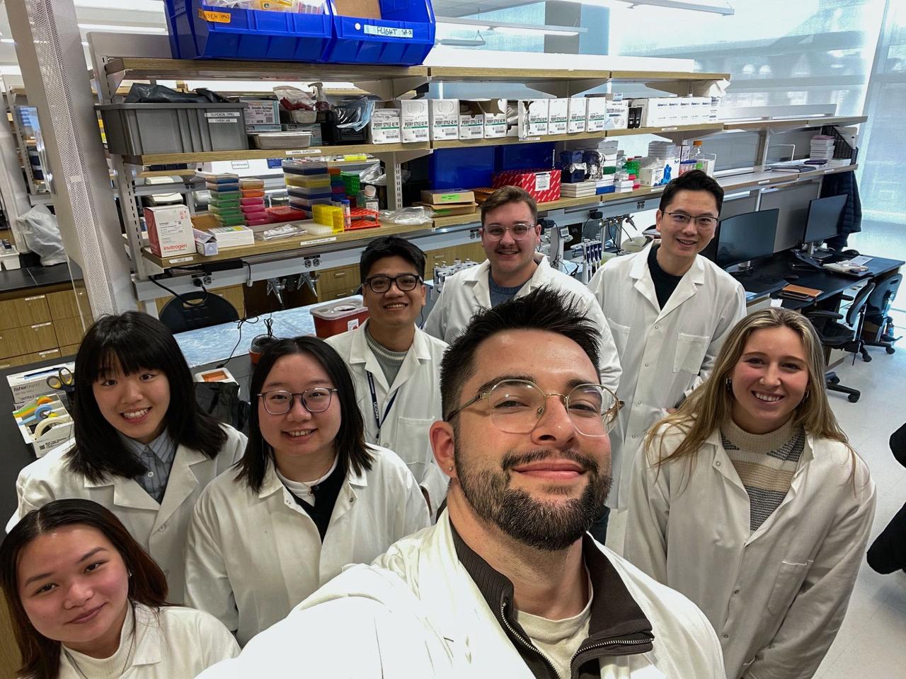 jsc2025e036189 (4/4/2025) --- The UCONN lab team who all contributed to space research leading up to DNA Nano Therapeutics-Mission 2. Front: Maxwell Landolina. In back, from left to right: Annie Nguyen (Ph.D. Student), Qianyu Chen (Undergraduate Student), Jin Zhai (Ph.D. Student), Toan Dang (Ph.D. Student), Trystin Cote (Ph.D. Student), Dr. Yupeng Chen (Principal Investigator), Madelyn Pickett (Master's Student). Biomimetic Fabrication of Multi-Functional DNA-Inspired Nanomaterials via Controlled Self-assembly in Space (DNA Nano Therapeutics-Mission 2) continues prior research on in-space manufacturing of nanomaterials that mimic DNA and have applications for vaccines and regenerative medicine. Image courtesy of University of Connecticut.