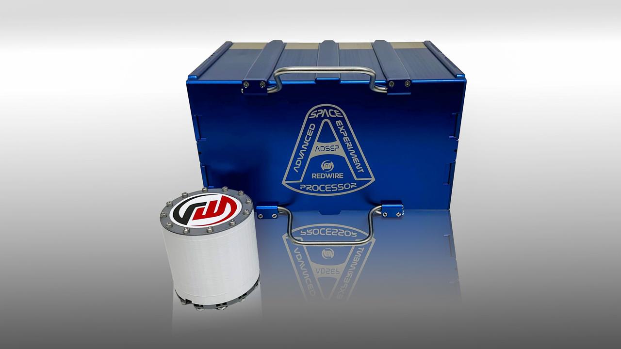 jsc2025e036383 (4/4/2025) --- The blue box is The Redwire Industrial Crystallization Cassette (ICC), a facility capable of large quantities of crystal growth. The white cylindrical growth chamber below the ICC is capable of holding 200mL in volume, compared to <1mL held by the PIL-BOX cassettes. The ADSEP Industrial Crystallization Cassette Technology Demonstration (ADSEP-ICC) investigation validates the ICC’s capability to grow large quantities of crystals in its high-volume crystal growth chambers aboard the International Space Station. Image courtesy of Redwire.