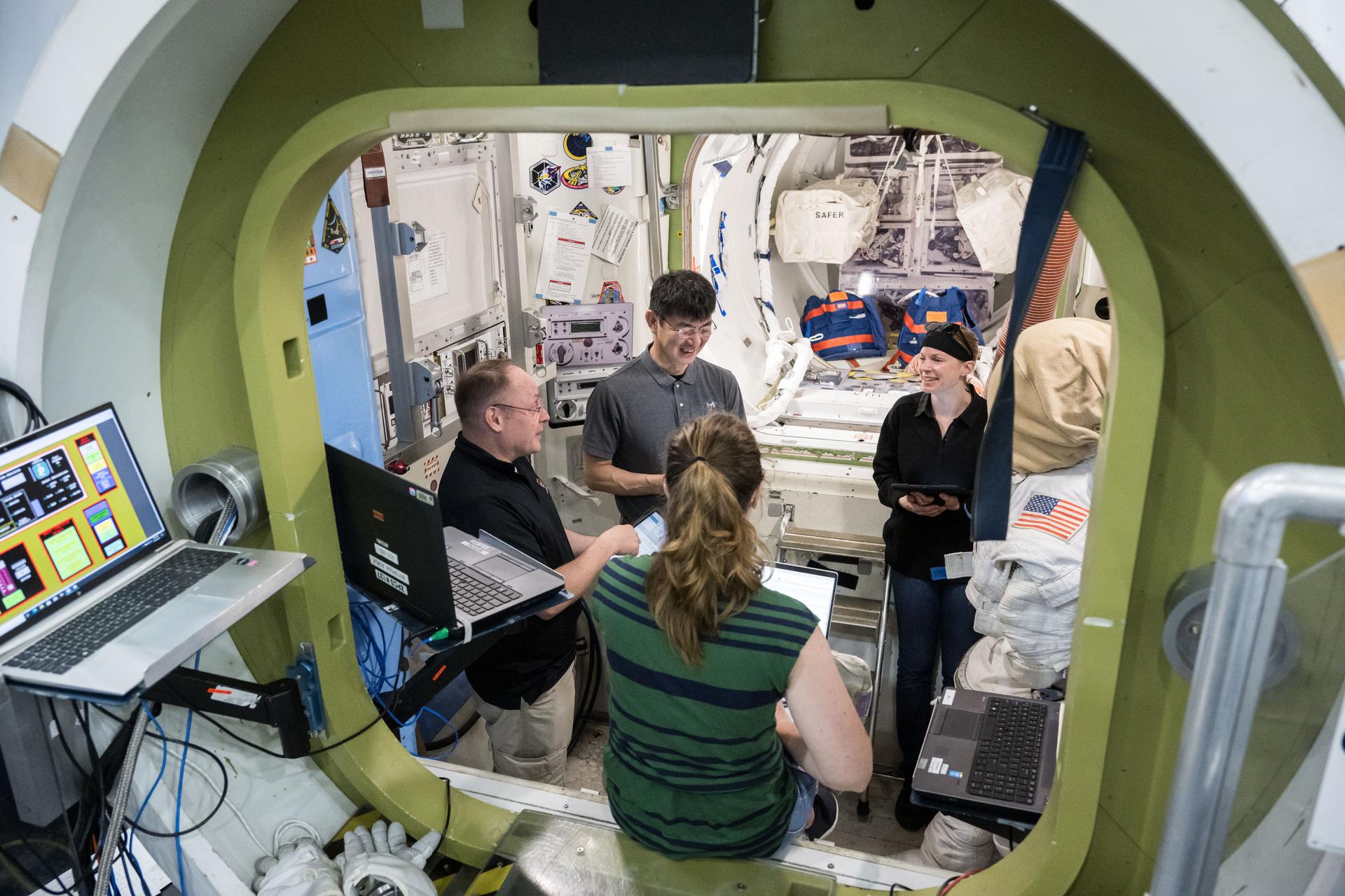 NASA astronauts Zena Cardman and Mike Fincke, and JAXA astronaut Kimiya Yui of NASA’s SpaceX Crew-11 crew trains for their International Space Station mission inside a mockup at NASA’s Johnson Space Center in Houston, Texas.
