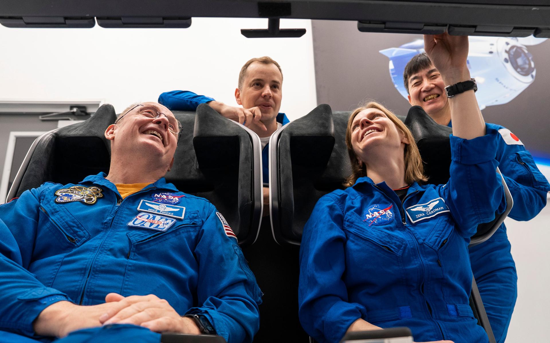 The four crew members of NASA's SpaceX Crew-11 mission to the International Space Station train inside a Dragon training crew spacecraft at SpaceX in Hawthorne, California. From left to right: NASA astronaut Mike Fincke, Roscosmos cosmonaut Oleg Platonov, NASA astronaut Zena Cardman, and JAXA astronaut Kimiya Yui.