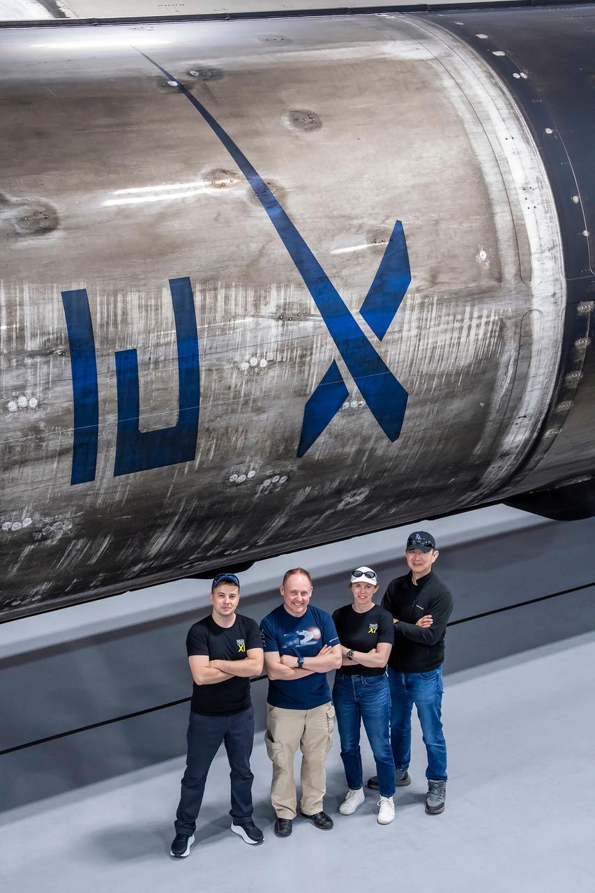 jsc2025e041093 (April 11, 2025) --- The four crew members of NASA's SpaceX Crew-11 mission to the International Space Station are pictured inside SpaceX’s Hangar X at NASA's Kennedy Space Center in Florida. From left to right: Roscosmos cosmonaut Oleg Platonov, NASA astronauts Mike Fincke and Zena Cardman, and JAXA astronaut Kimiya Yui.