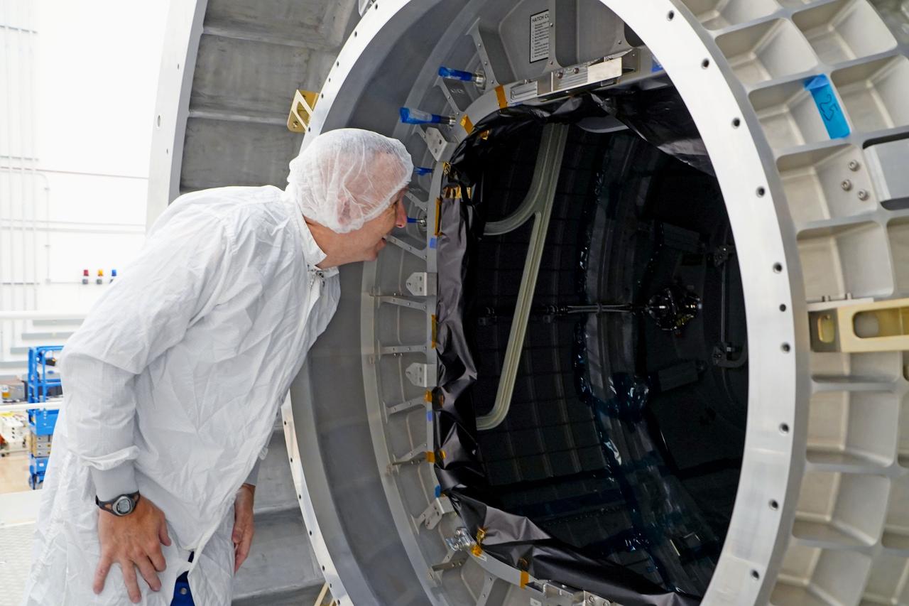 NASA astronaut Randy Bresnik peers inside the HALO module during a close-up look on April 24, 2024, at Northrop Grumman’s facility in Gilbert, Arizona. The visit was part of an event commemorating HALO’s arrival in the United States, marking a major milestone for Gateway.