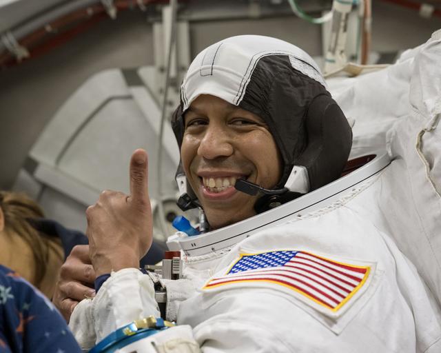 NASA image: NASA astronaut Chris Williams poses for a photo in a spacesuit