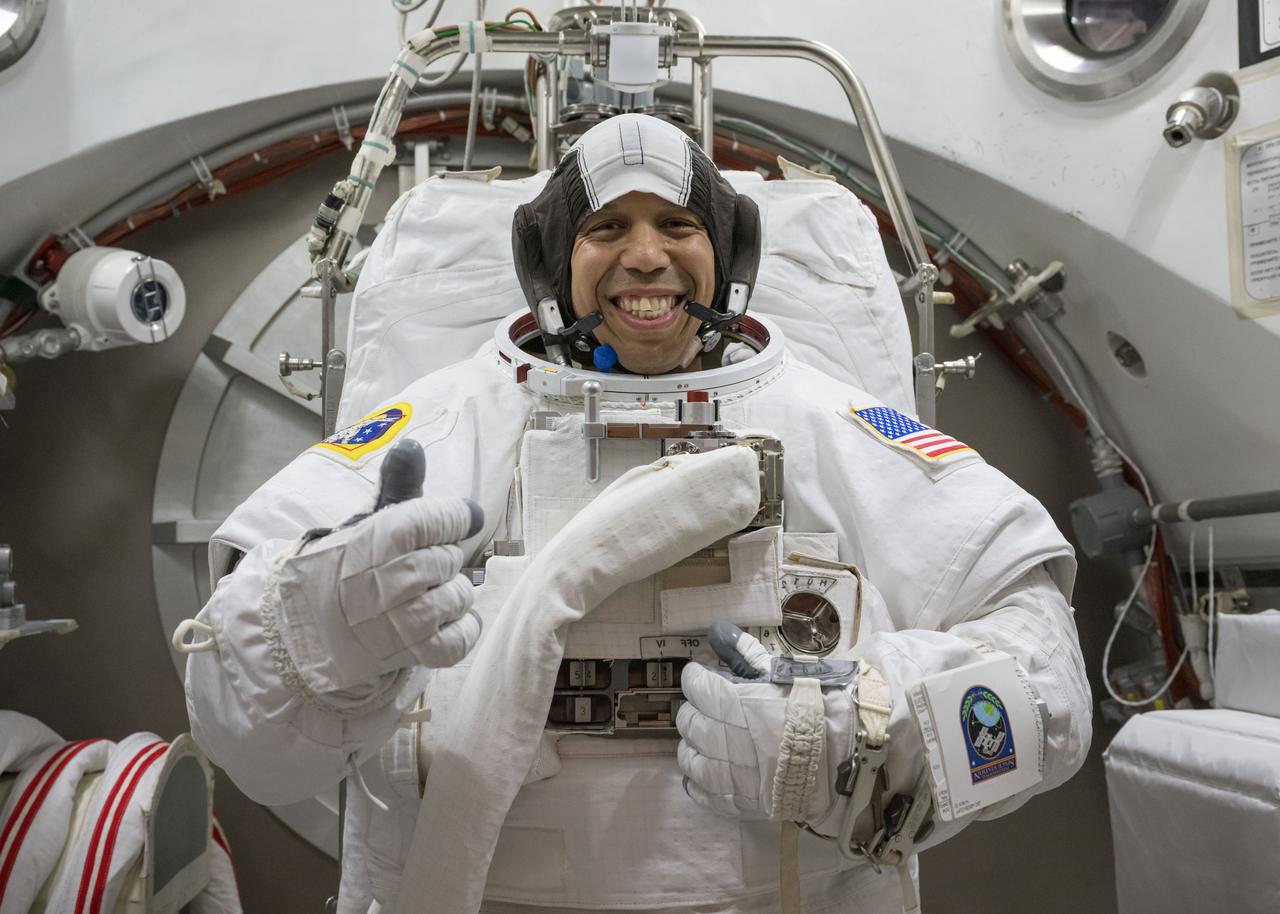 jsc2025e044433 (May 6, 2025) --- NASA astronaut Chris Williams poses for a photo in an Extravehicular Mobility Unit spacesuit during vacuum chambers testing at NASA’s Johnson Space Center in Houston, Texas. 