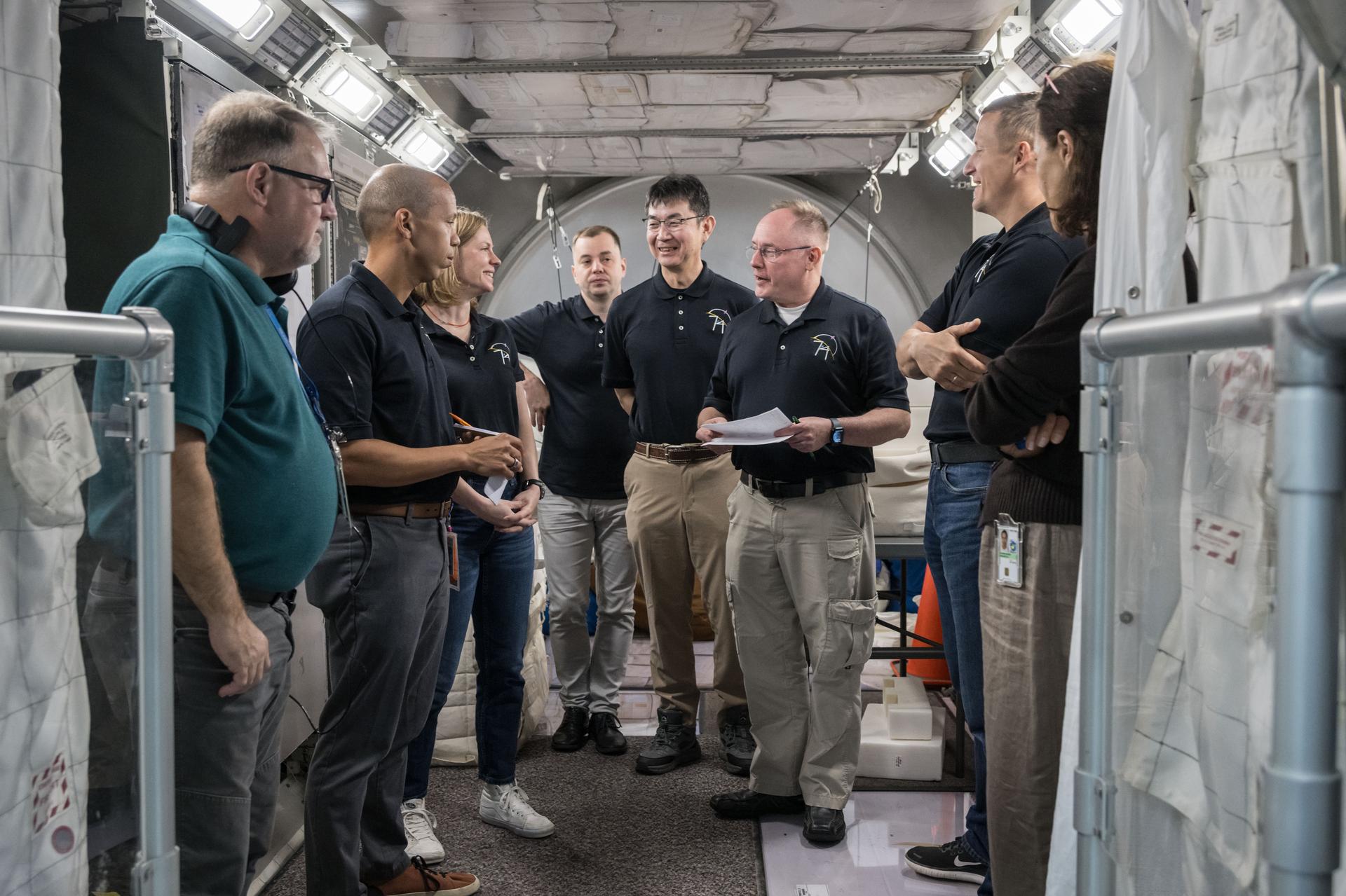 The International Space Station’s Expedition 74 crew, including NASA astronauts Zena Cardman, Mike Fincke, and Chris Williams, JAXA (Japan Aerospace Exploration Agency) astronaut Kimiya Yui, and Roscosmos Cosmonauts Oleg Platonov and Sergey Kud-Sverchokov participate in a training simulation inside a mockup at NASA’s Johnson Space Center in Houston, Texas.