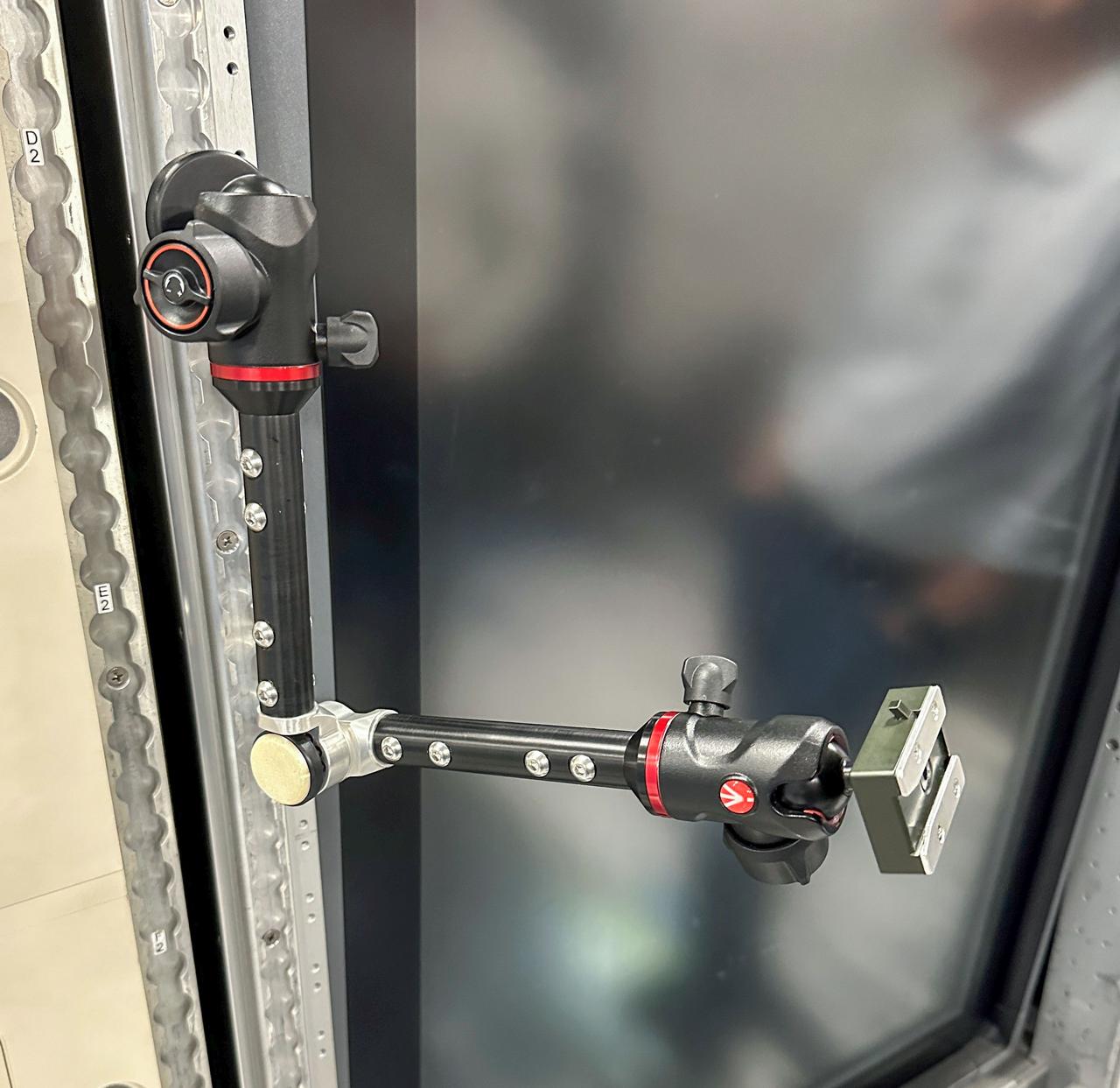 jsc2025e047414 (5/27/2025) --- The High school Students United with NASA to Create Hardware (HUNCH) has designed a device to replace Bogen arms aboard the International Space Station. The HUNCH Utility Bracket (HUB) can be attached to frames and rails and can hold cameras, iPads, and other equipment. The HUB has a jointed design that allows ample range of movement and flexibility. This device aims to aid crew members with tasks such as recording videos and holding iPads to increase efficiency of operations aboard space station. (Image courtesy of HUNCH)