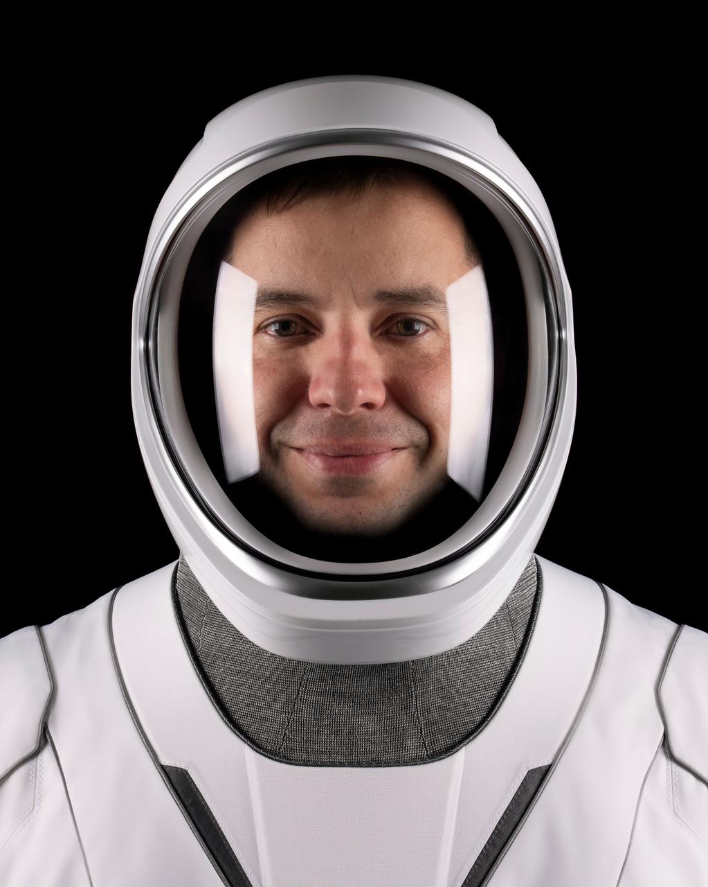 jsc2025e060298 (May 19, 2025) --- Roscosmos cosmonaut Oleg Platonov, mission specialist of NASA’s SpaceX Crew-11 mission to the International Space Station, poses for a portrait in his pressure suit at SpaceX headquarters in Hawthorne, California. Credit: SpaceX