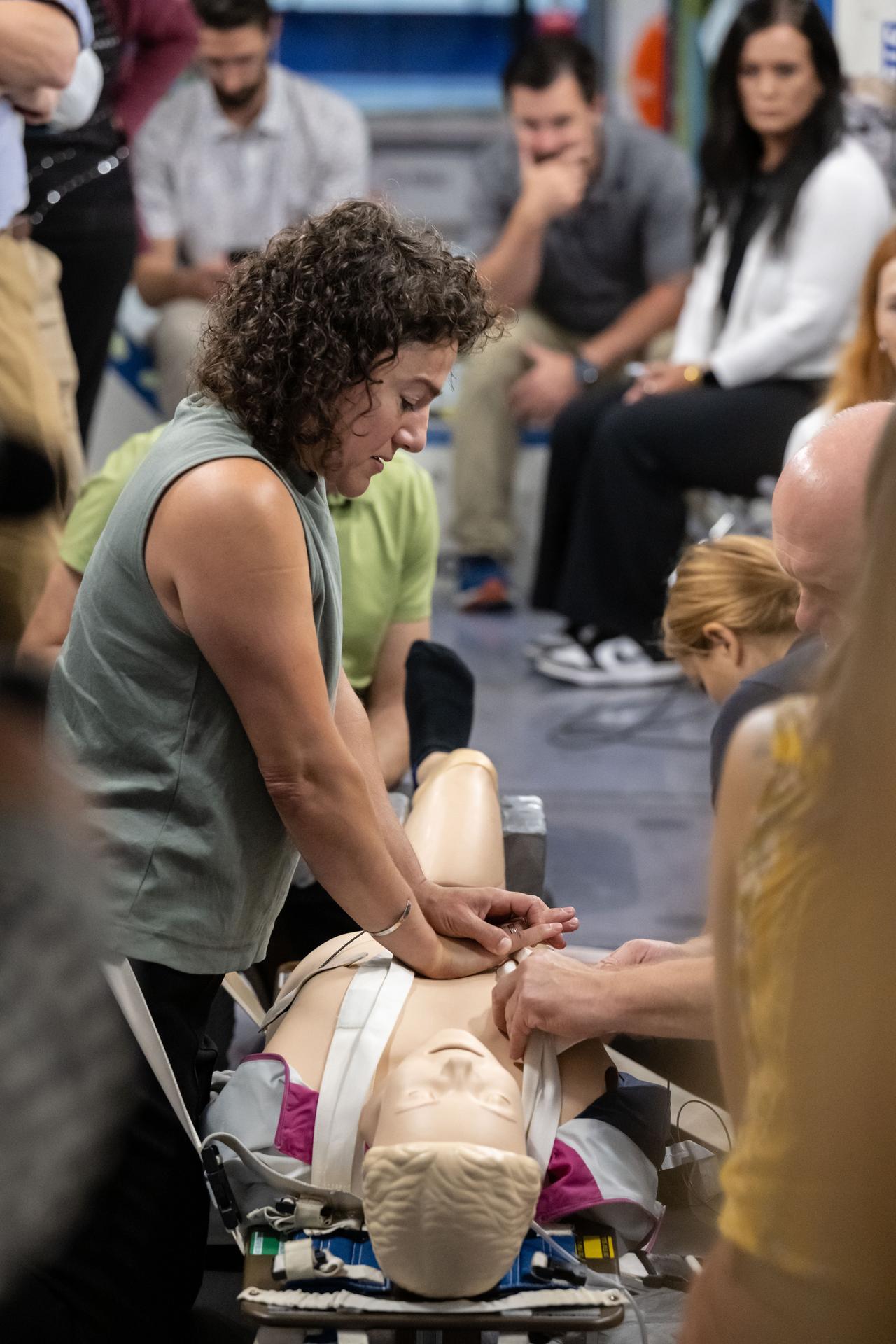 NASA astronaut Jessica Meir practices cardiopulmonary resuscitation (CPR) during a medical emergency simulation as part of her training for NASA's SpaceX Crew-12 mission to the International Space Station. Surrounding Meir are various training support personnel at NASA's Johnson Space Center in Houston, Texas.