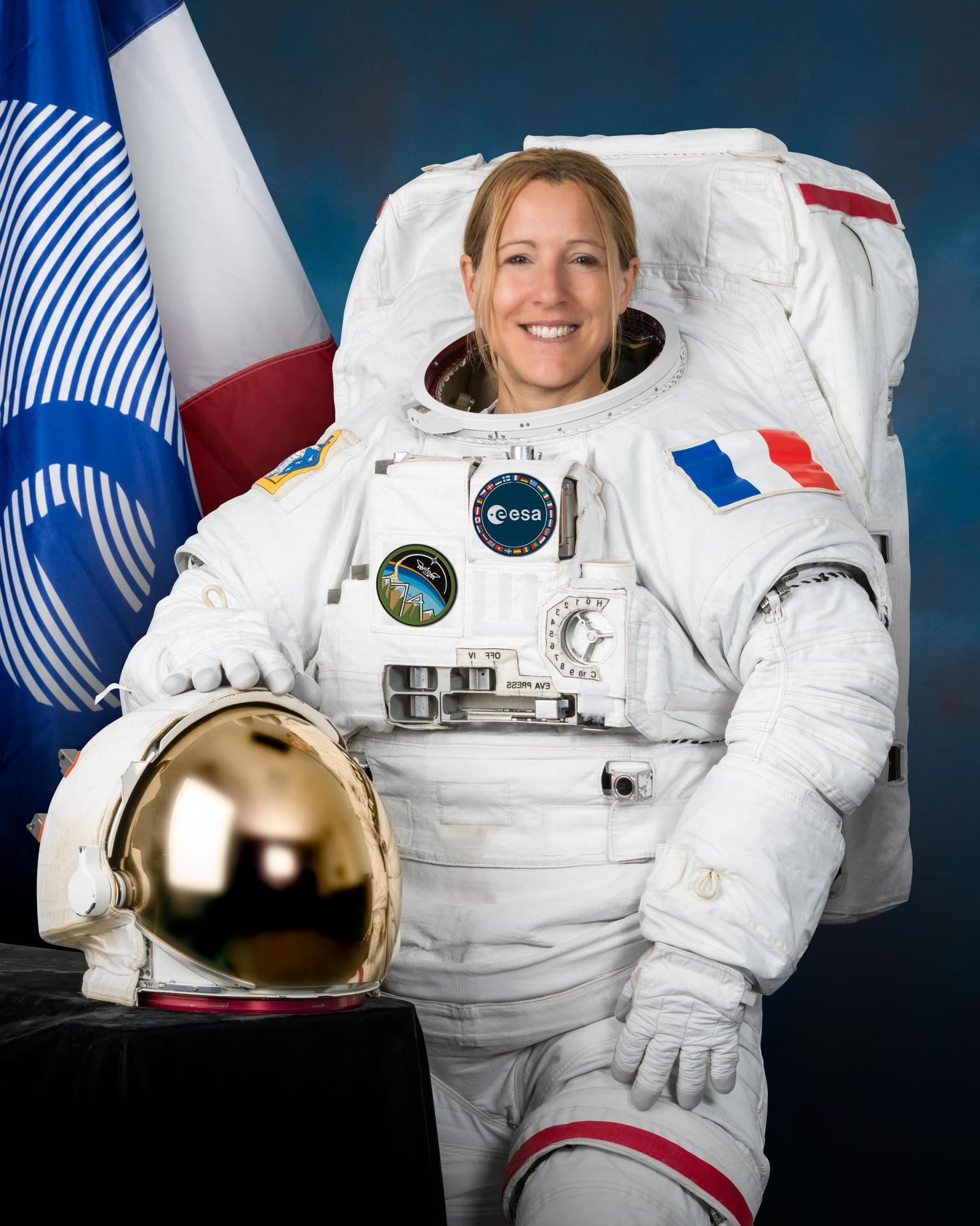 Official portrait of ESA (European Space Agency) astronaut Sophie Adenot wearing a spacesuit, also called an Extravehicular Mobility Unit (EMU), at NASA's Johnson Space Center in Houston, Texas.