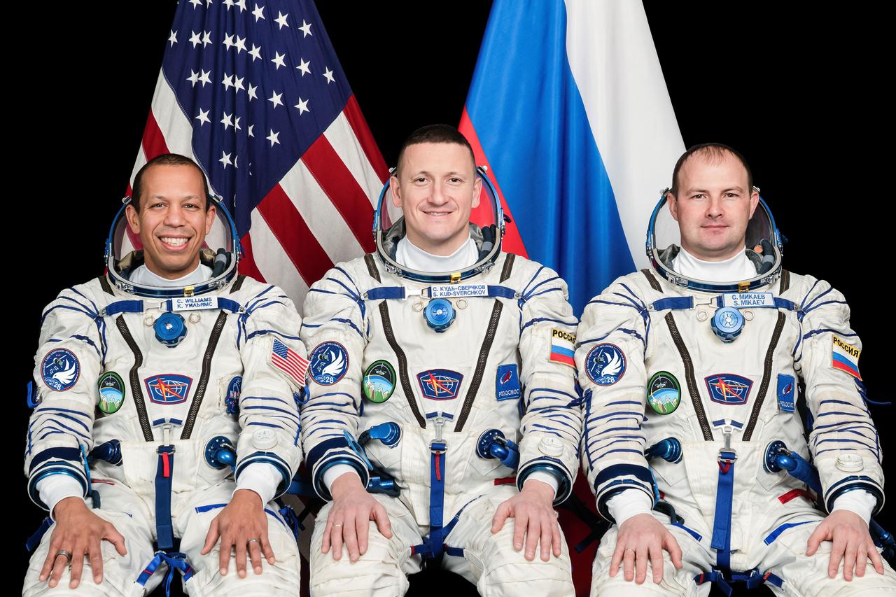 jsc2025e074496 (Dec. 12, 2024) --- Soyuz MS-28 crew members (from left) NASA astronaut Chris Williams and Roscosmos cosmonauts Sergey Kud-Sverchkov and Sergey Mikaev pose for a portrait at the Gagarin Cosmonaut Training Center in Russia. Credit: GCTC