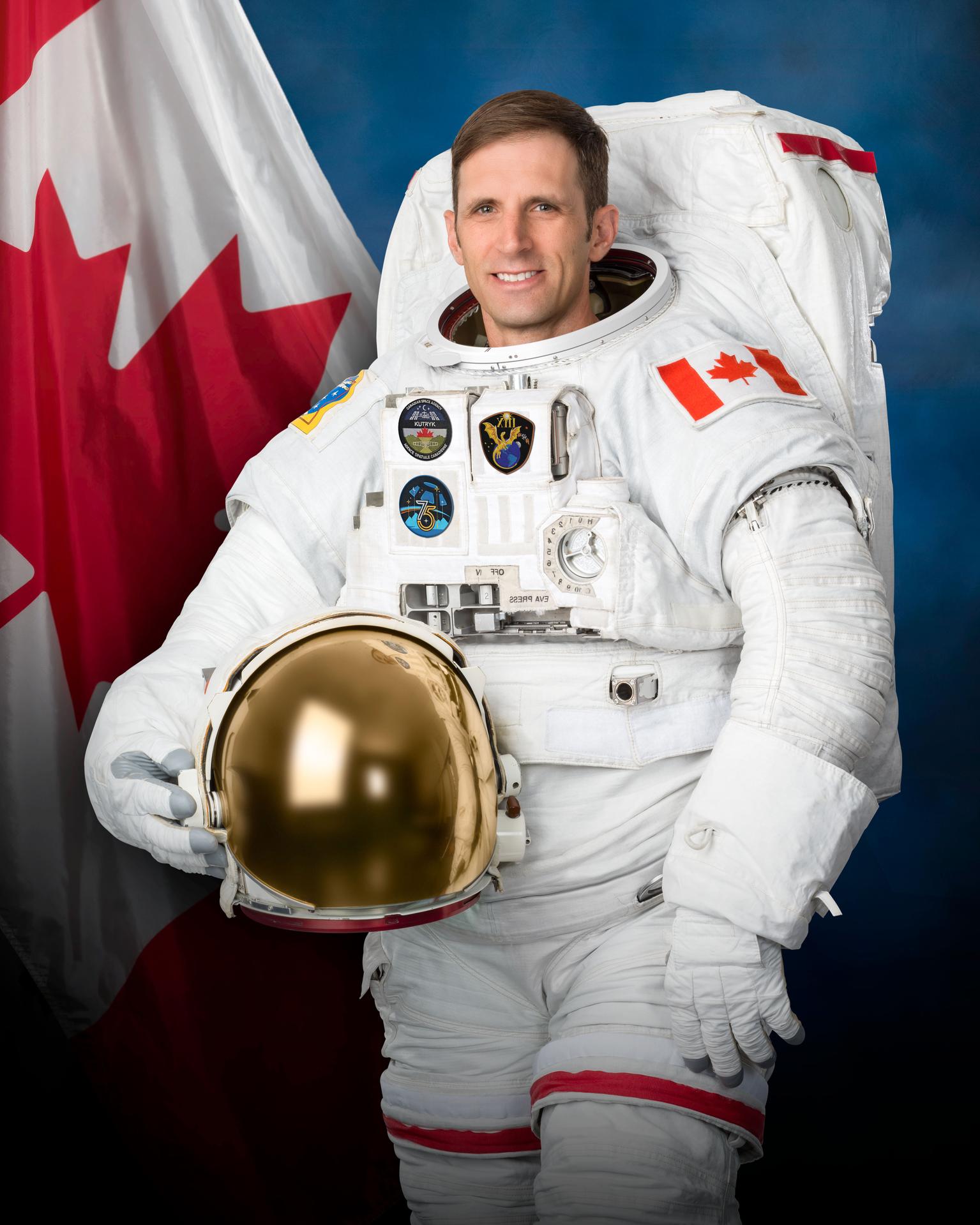 Astronaut Joshua Kutryk of CSA (Canadian Space Agency) poses for an official portrait while wearing a spacesuit at NASA's Johnson Space Center in Houston, Texas.
