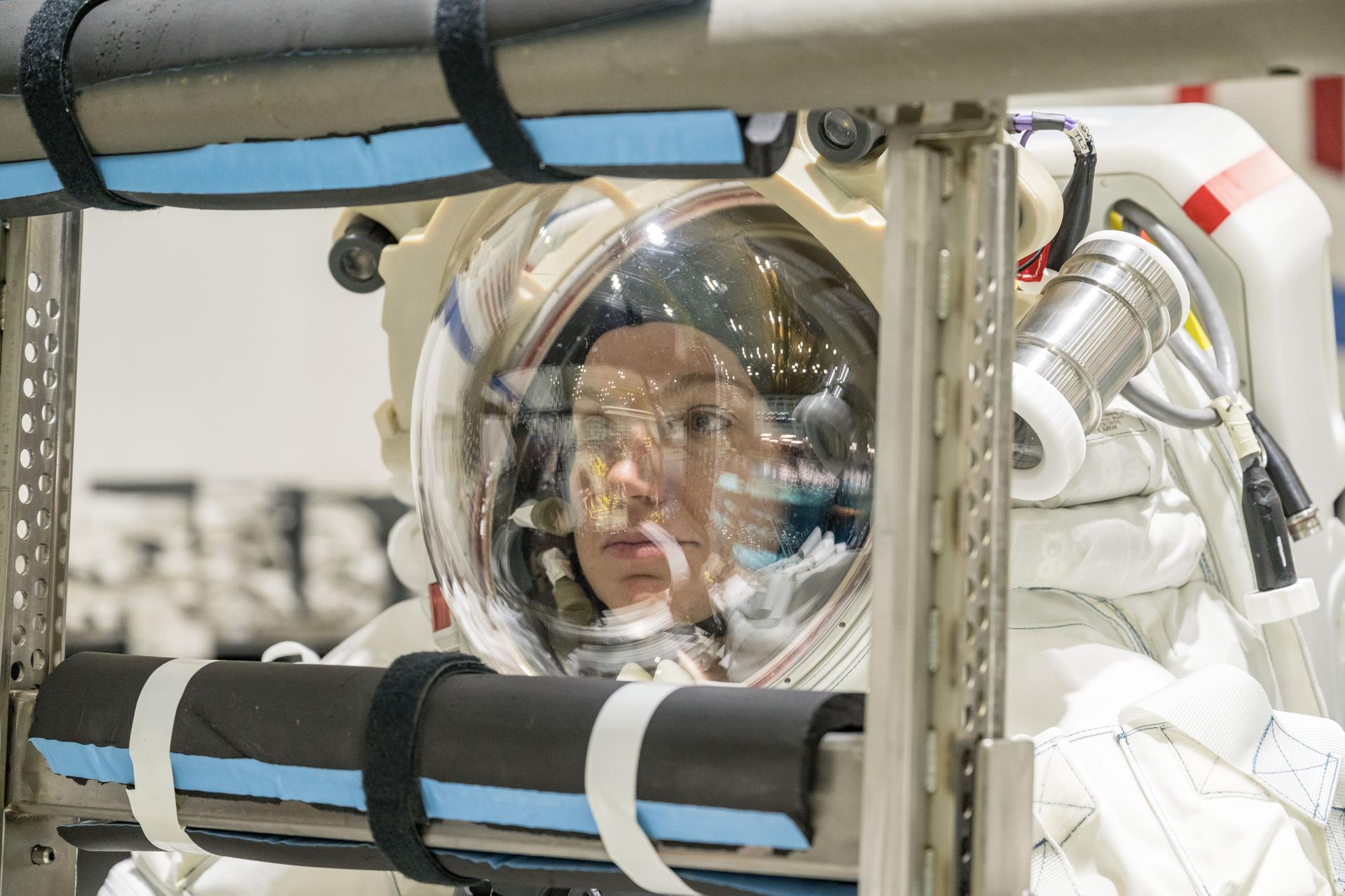 Canadian Space Agency astronaut Jenni Gibbons gets suited up in Axiom Space’s lunar spacesuit at NASA’s Neutral Buoyancy Laboratory in Houston. During a recent test series, NASA engineers and crewmembers wore the lunar spacesuit under water and conducted numerous tasks during simulated lunar operations to test its mobility and functionality and ensure the spacesuit is prepped and ready for Artemis training.