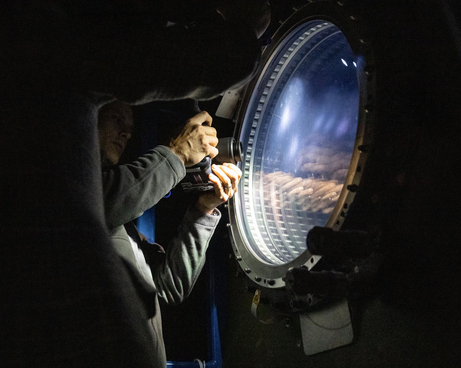 NASA astronaut and Expedition 75 flight engineer Anil Menon participates in a photography training session at Johnson Space Center's Space Vehicle Mockup Facility in Houston, Texas, ahead of his upcoming mission to the International Space Station.