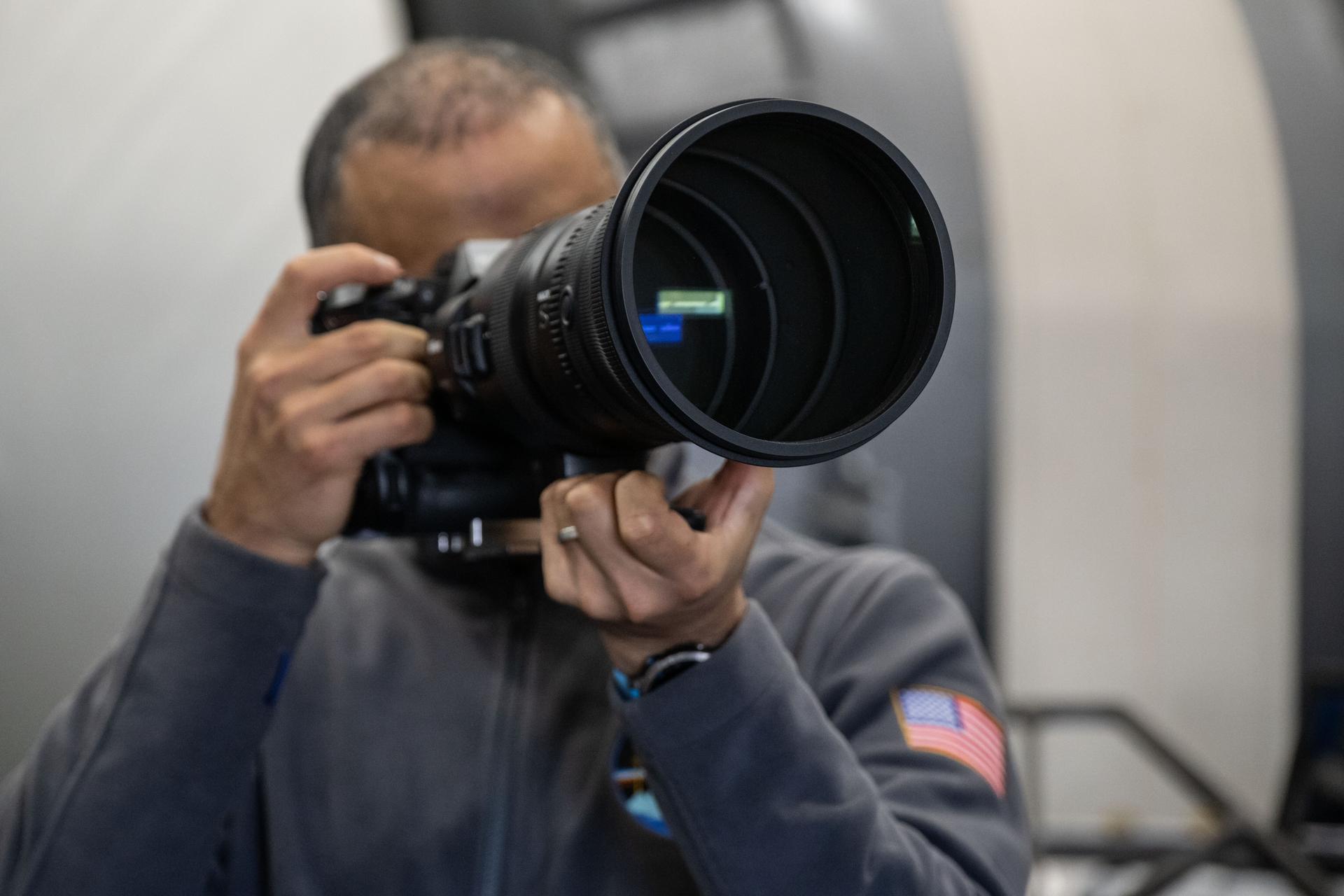 NASA astronaut and Expedition 75 flight engineer Anil Menon participates in a photography training session at Johnson Space Center's Space Vehicle Mockup Facility in Houston, Texas, ahead of his upcoming mission to the International Space Station.