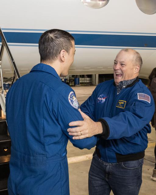 NASA image: NASA astronaut Jonny Kim is greeted by Chief of the Astronaut Office Scott Tingle