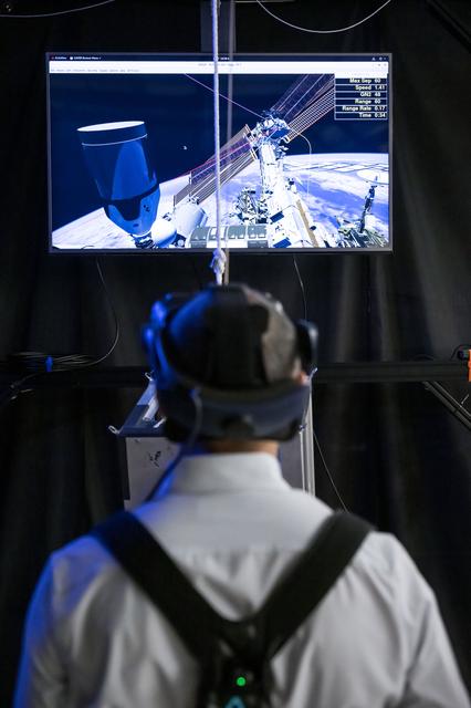 NASA image: NASA astronaut Anil Menon wears virtual reality goggles for a spacewalk training session