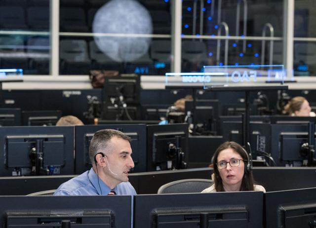 jsc2026e000841 --- Artemis II Science Officers, Trevor Graff, left, and Kelse...