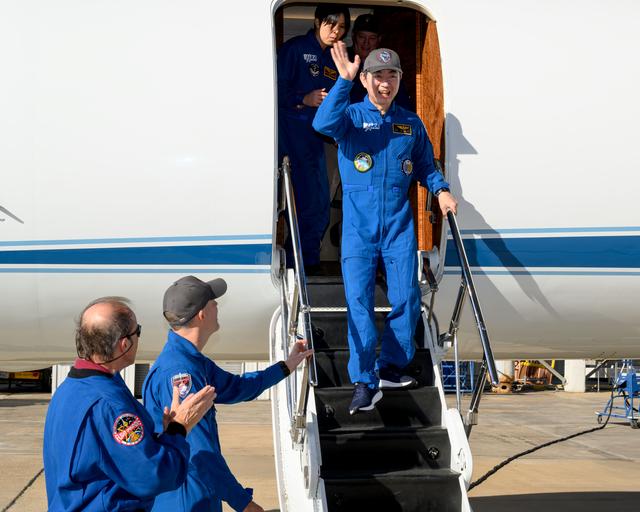 NASA image: JAXA astronaut Kimiya Yui waves to officials at Ellington Field in Houston, Texas