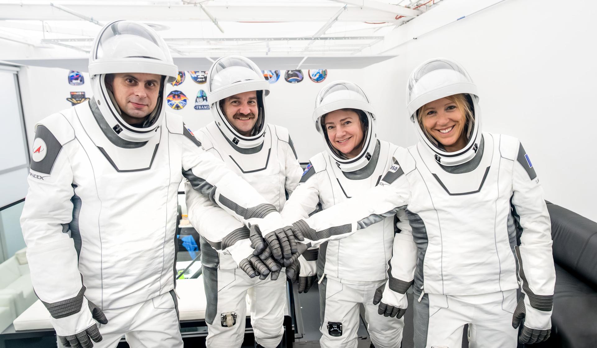 The four members of NASA's SpaceX Crew-12 mission to the International Space Station pose together for a crew portrait in their pressure suits at SpaceX headquarters in Hawthorne, California. From left are, Roscosmos cosmonaut and Mission Specialist Andrey Fedyaev, NASA astronauts Jack Hathaway and Jessica Meir, Pilot and Commander respectively, and ESA (European Space Agency) astronaut and Mission Specialist Sophie Adenot.