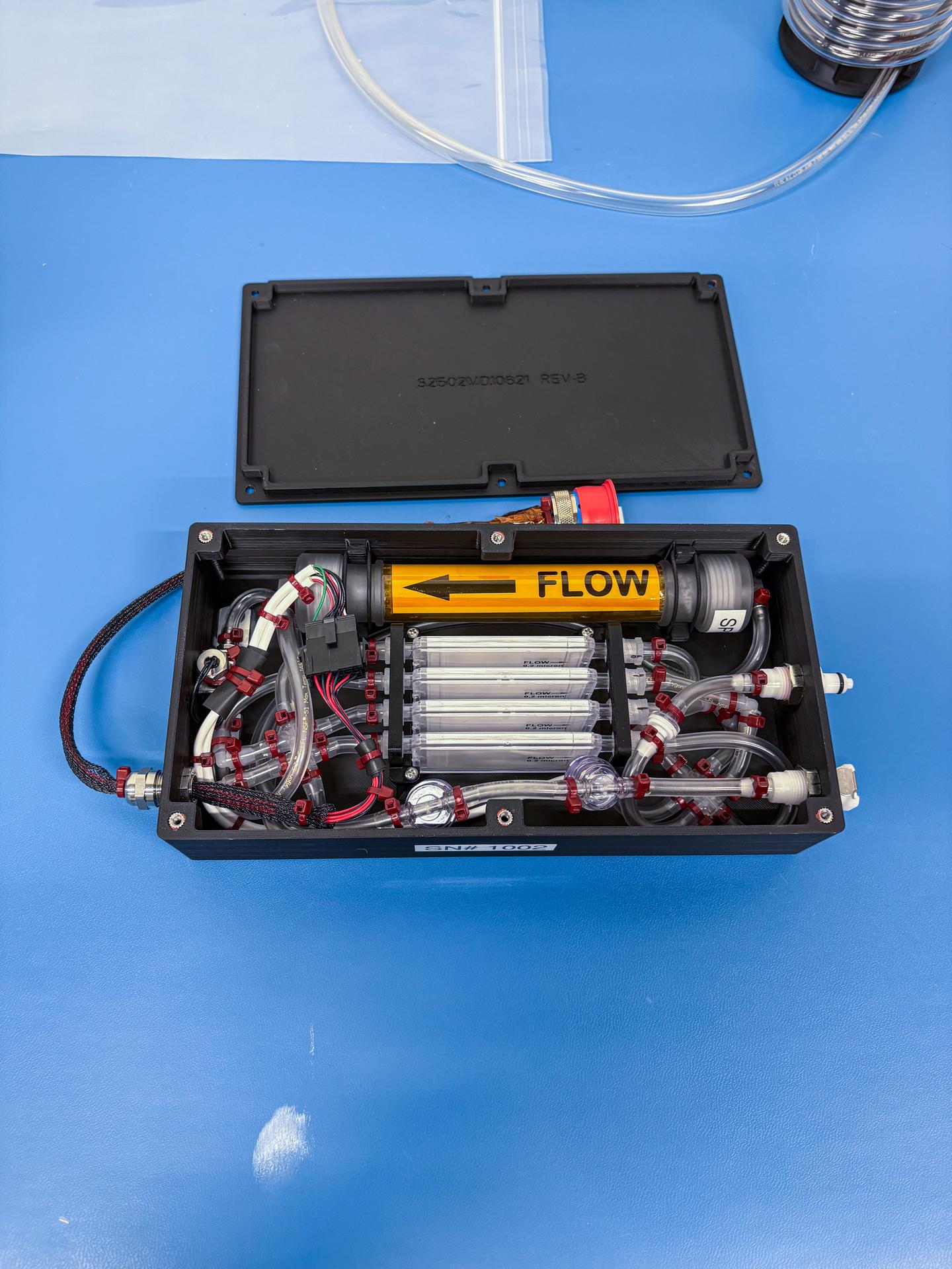 jsc2026e004238 (February 02, 2026) -- A preflight image of the miniaturized sterilization system as part of IVGEN mini. This investigation aims to verify operations to make medical-grade saline solution using potable water aboard the International Space Station. On future exploration missions, this system could give crew members the ability to generate intravenous fluids on demand. Credit: NASA.