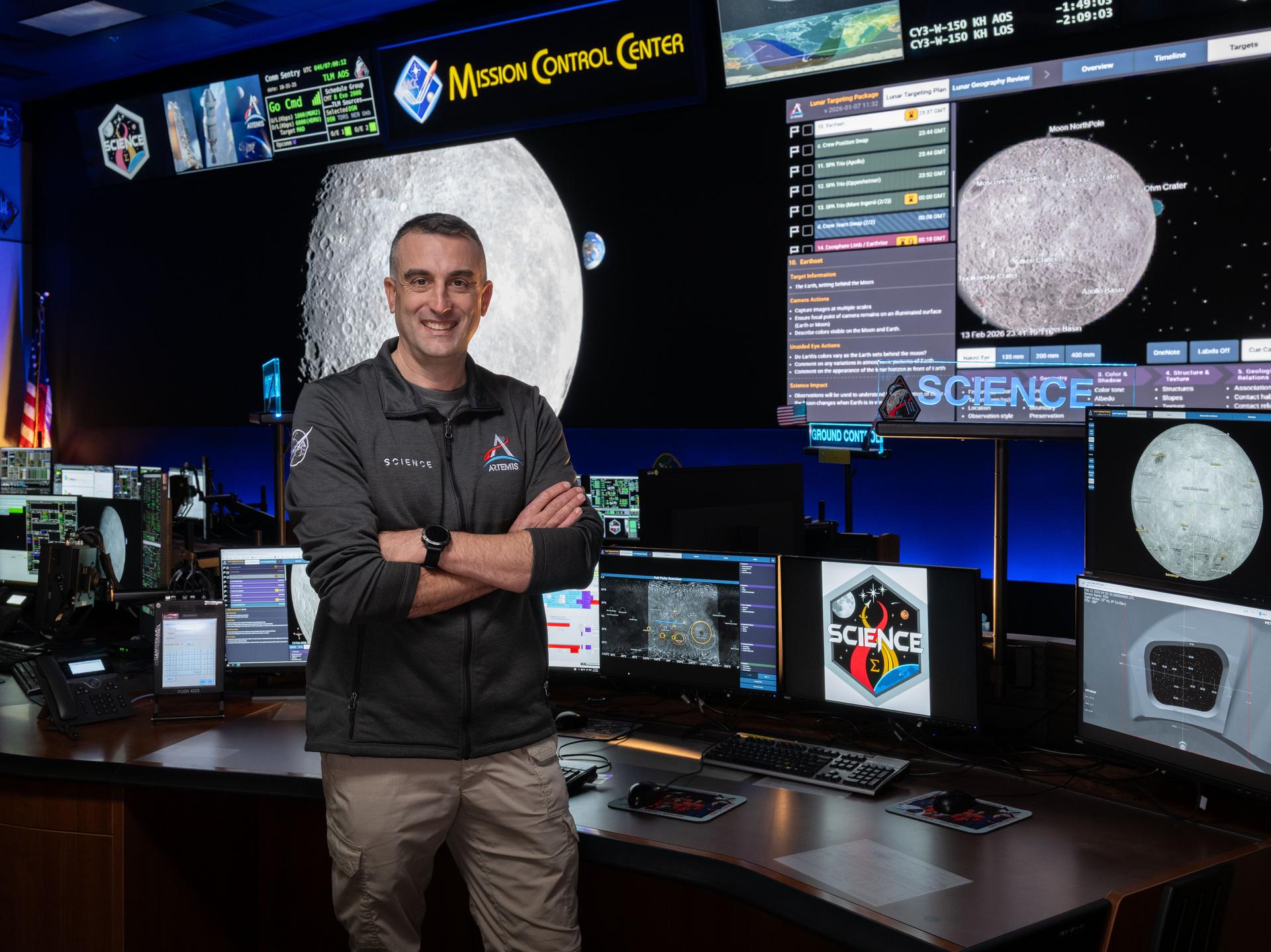 Artemis science officer, Trevor Graff, stands at the new SCIENCE console in the Mission Control Center at NASA’s Johnson Space Center in Houston. Credits: NASA/Josh Valcarcel