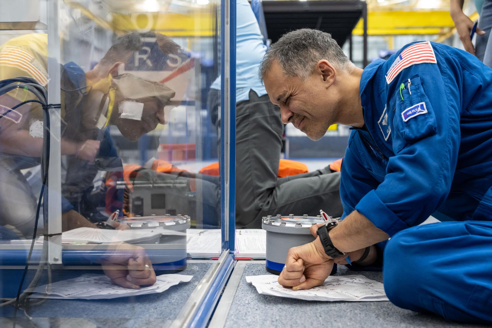NASA astronaut and Expedition 75 flight engineer Anil Menon participates in an emergency training session at Johnson Space Center's Space Vehicle Mockup Facility in Houston, Texas, ahead of his upcoming mission to the International Space Station.