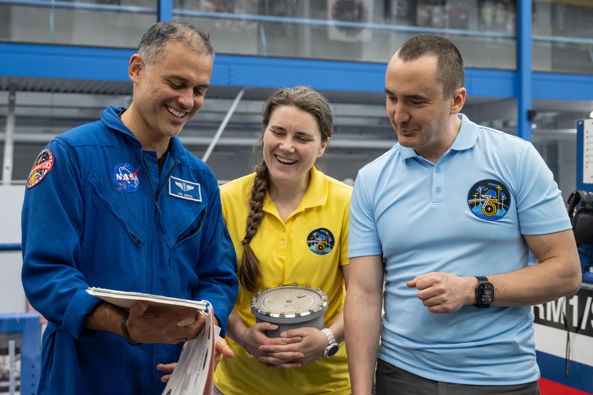From left, Expedition 75 crew members Anil Menon, Anna Kikina, and Pyotr Dubrov participate in an emergency training session at Johnson Space Center's Space Vehicle Mockup Facility in Houston, Texas, ahead of their upcoming mission to the International Space Station.